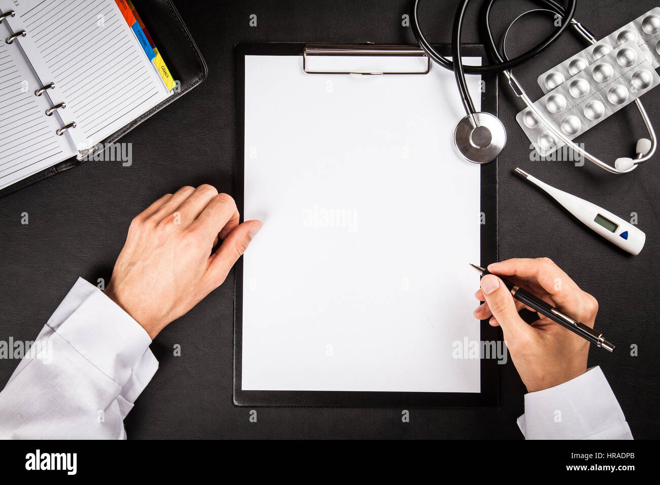 Doctor's working table Stock Photo - Alamy