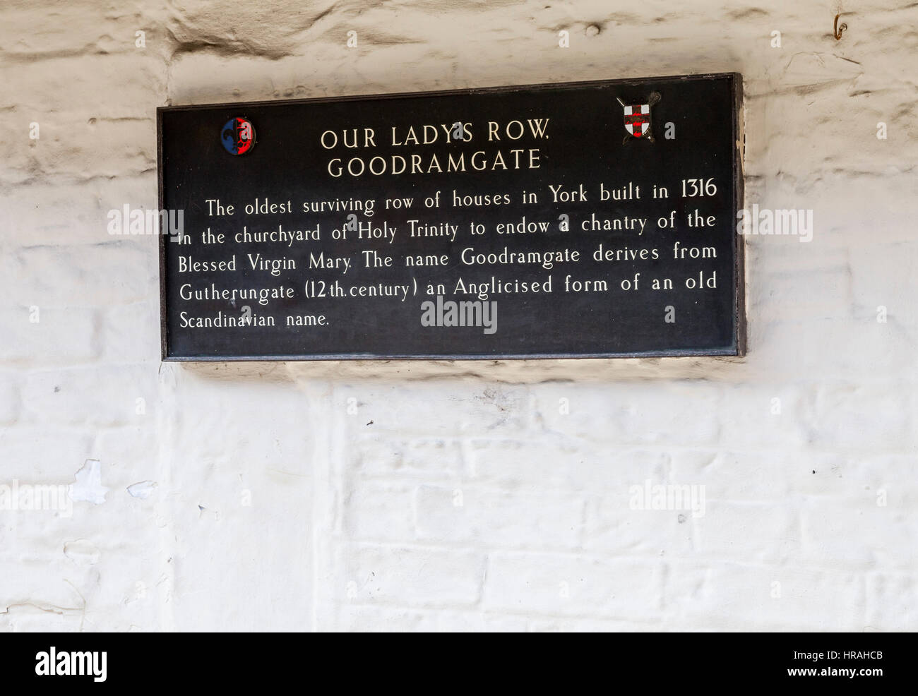 A plaque on the wall of Our Ladys Row of historic houses in Goodramgate, York Stock Photo