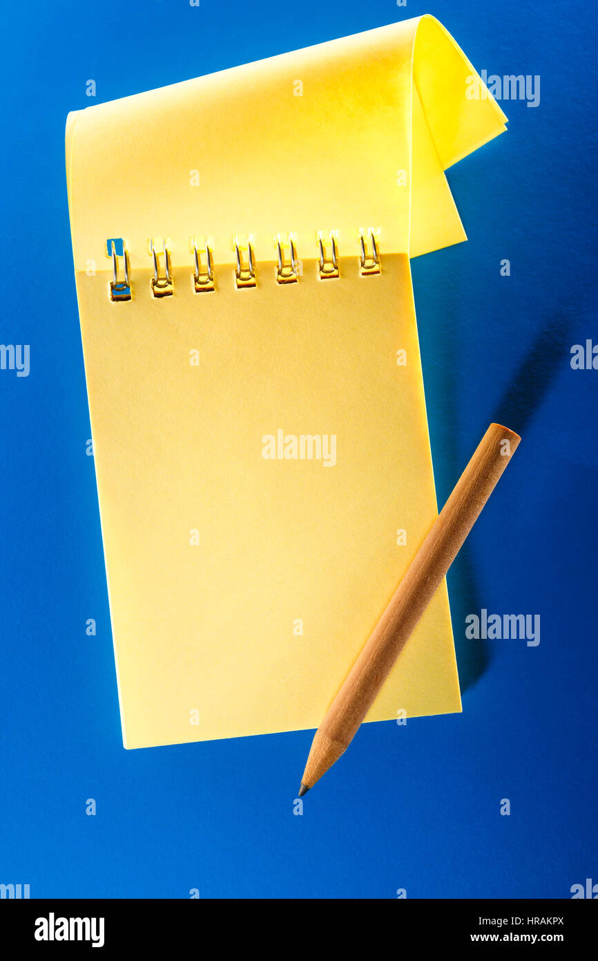 Blank open notebook on the blue background Stock Photo - Alamy