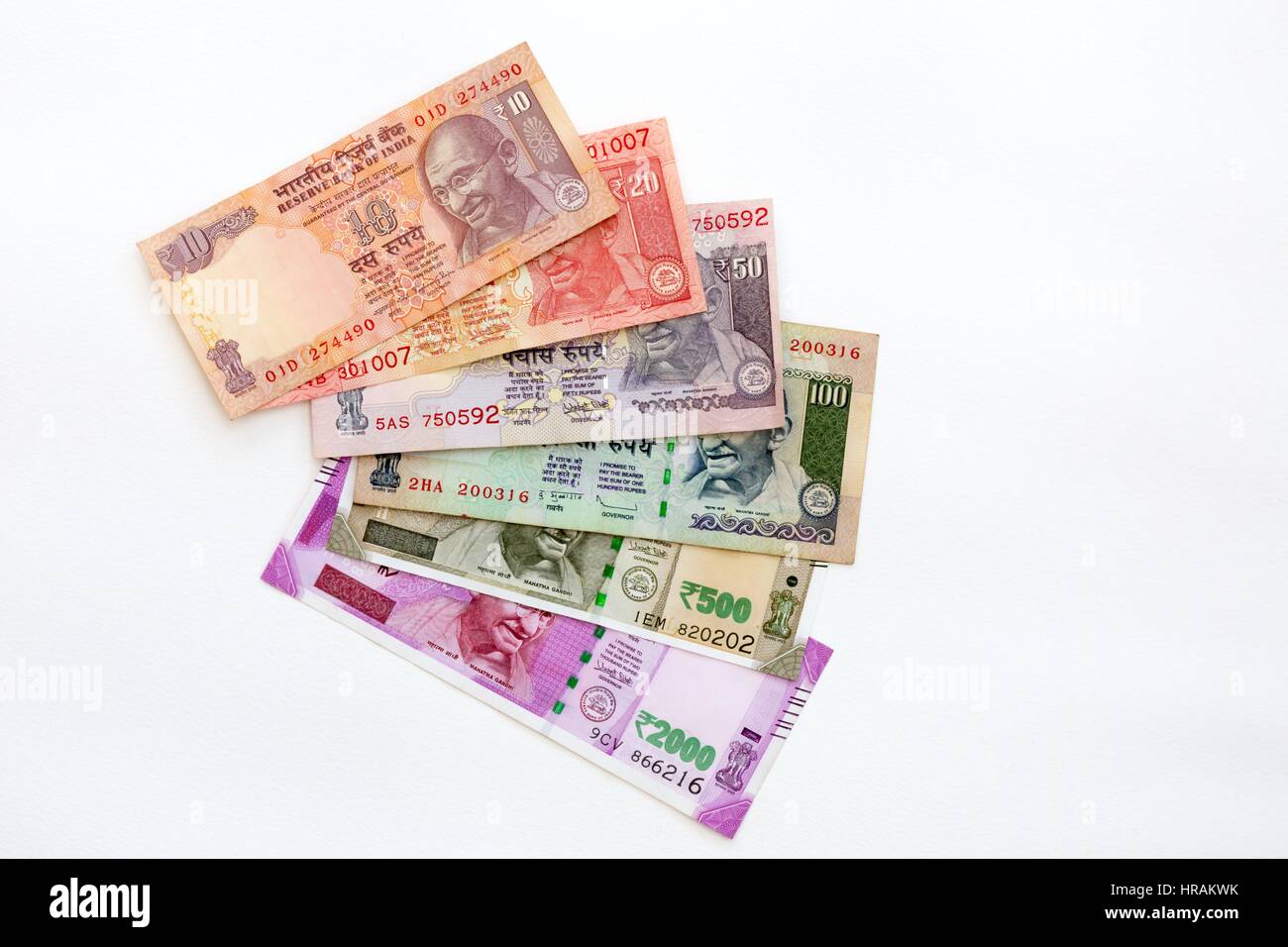 Indian Rupees - Indian currency notes of various denominations on a white background Stock Photo