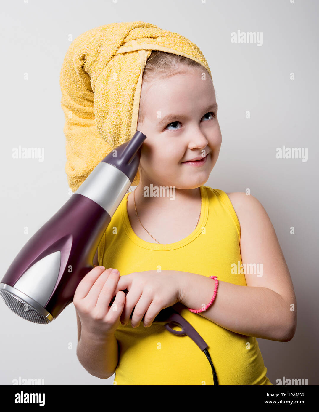 little girl after a shower with a Hairdryer Stock Photo Alamy