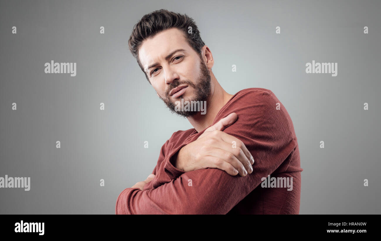 Cool expressive young man portrait with crossed arms Stock Photo - Alamy
