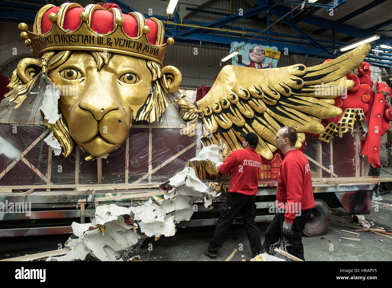 Duesseldorf, Germany. 28th Feb, 2017. WorkerS take apart a float after the Shrove Monday carnival parade in Duesseldorf, Germany, 28 February 2017. More than a hundred thousand people attended the celebrations, which are being dismantled a day later. Photo: Federico Gambarini/dpa/Alamy Live News Stock Photo