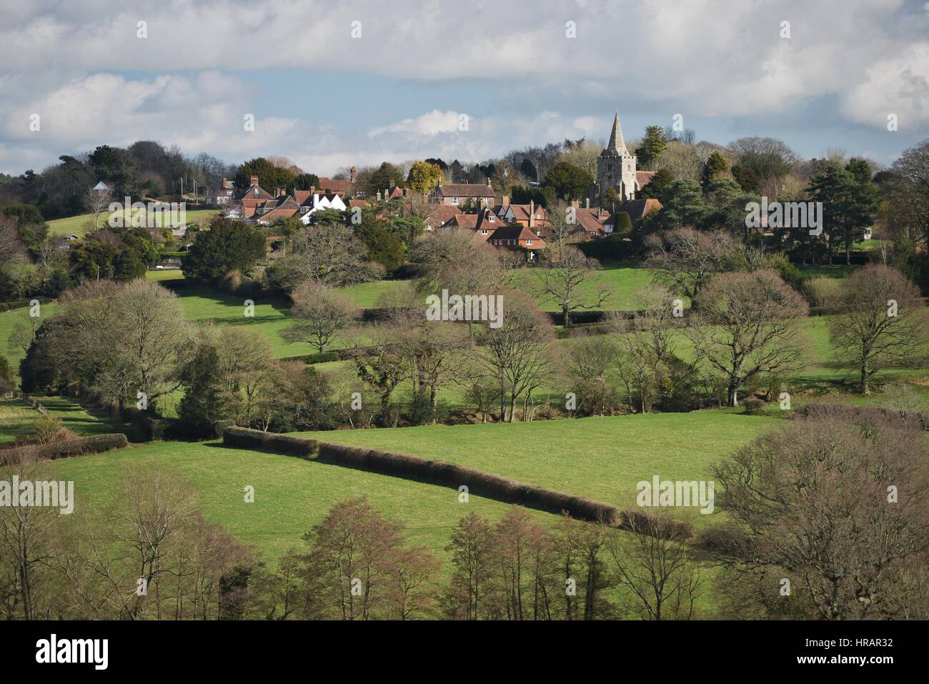 Dallington, East Sussex, UK 28th February 2017. Bright sunshine and blue sly over the pretty hill top village of Dallington, East Sussex, UK. Credit: Peter Cripps/Alamy Live News Stock Photo