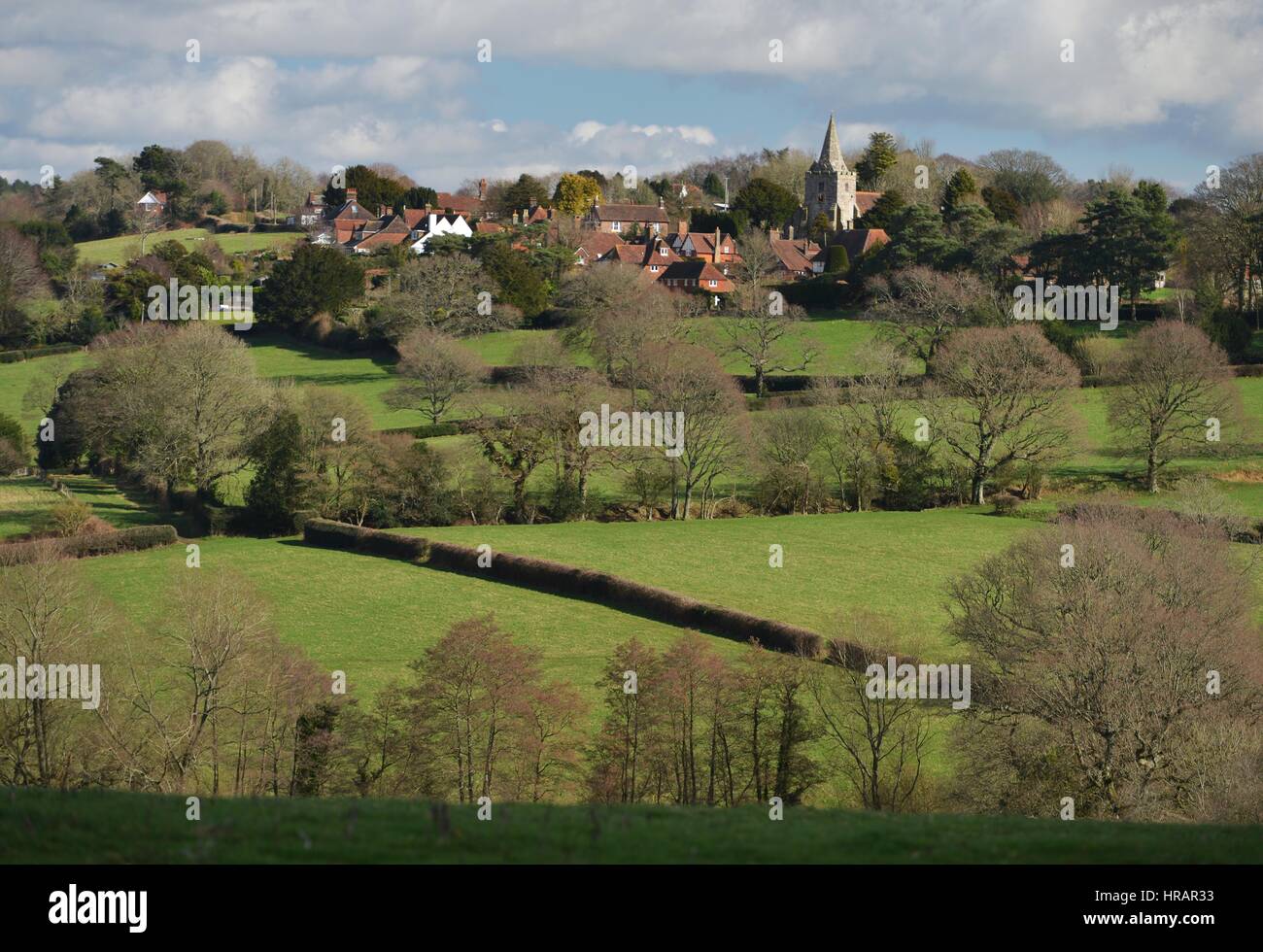 Dallington, East Sussex, UK 28th February 2017. Bright sunshine and blue sly over the pretty hill top village of Dallington, East Sussex, UK. Credit: Peter Cripps/Alamy Live News Stock Photo