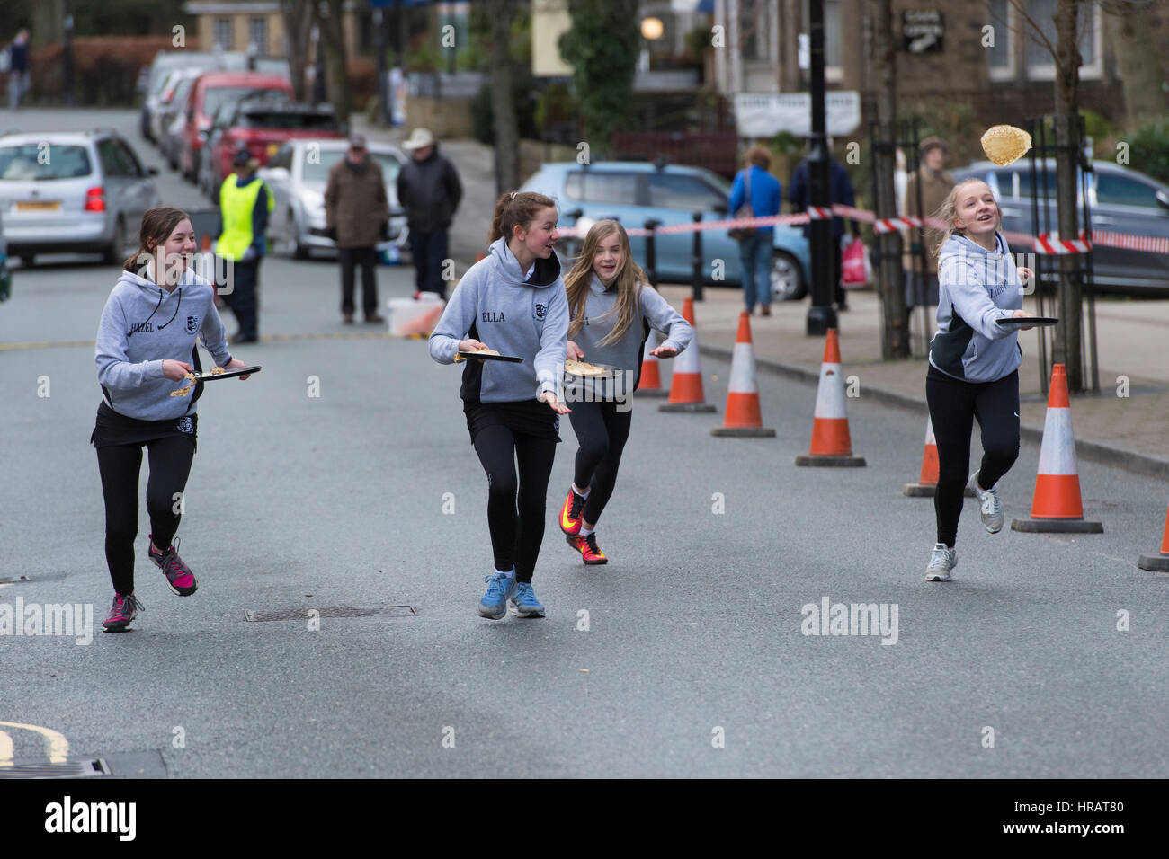 The Grove, Ilkley, West Yorkshire, UK. 28th Feb, 2017. Young female competitors (school girls) are running and taking part in the traditional, annual Ilkley Rotary Pancake Race. Credit: Ian Lamond/Alamy Live News Stock Photo