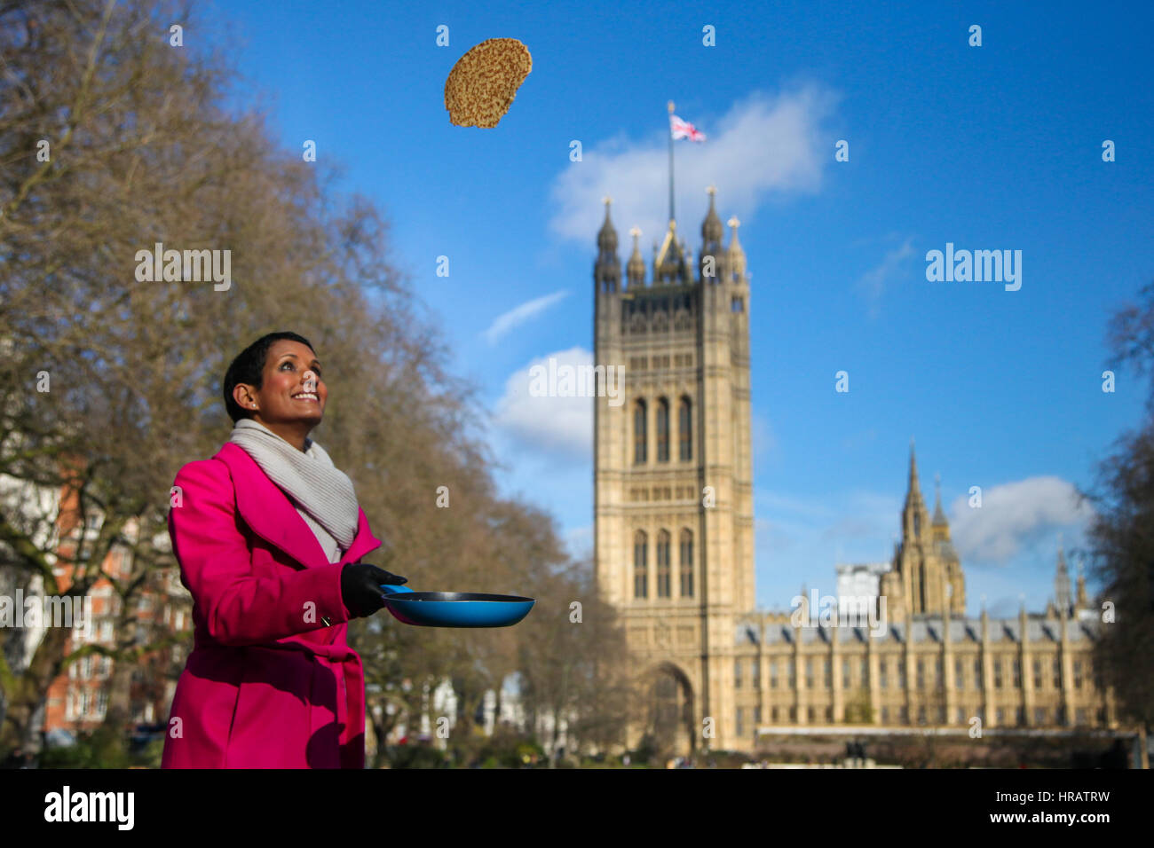 Victoria Tower Gardens, London, UK. 28th Feb, 2017. BBC Breakfast's Naga Munchetty - The Official Starter tossing the pancake. Lords, MPs and members of media teams take part in pancake race - celebrating 20 years of flipping for Rehab charity and its work with disabled people. Credit: Dinendra Haria/Alamy Live News Stock Photo