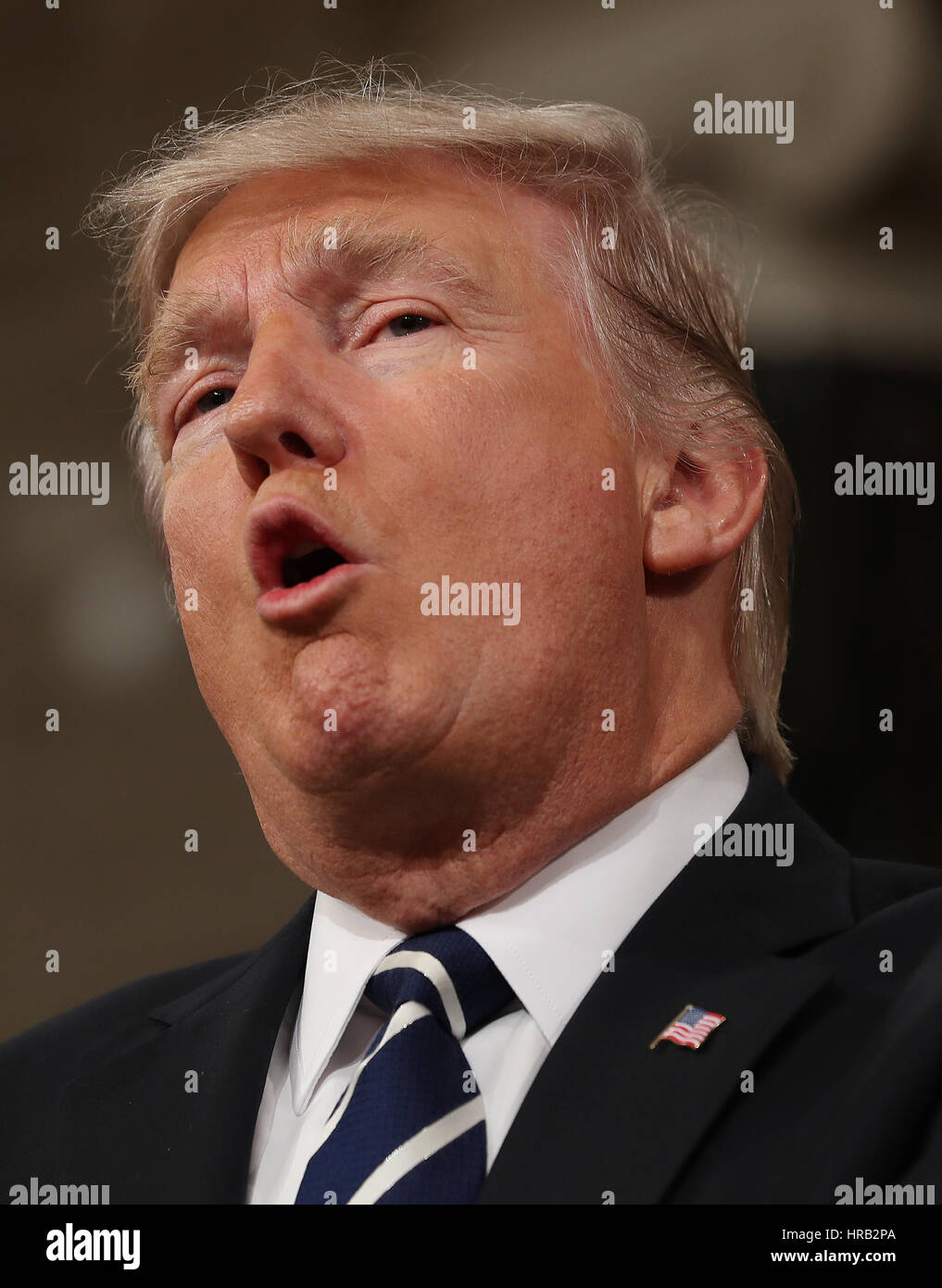 Washington, DC, USA. 28th Feb, 2017. US President Donald J. Trump (C) arrives to deliver his first address to a joint session of Congress from the floor of the House of Representatives in Washington, DC, USA, 28 February 2017. Traditionally the first address to a joint session of Congress by a newly-elected president is not referred to as a State of the Union. Credit: MediaPunch Inc/Alamy Live News Stock Photo