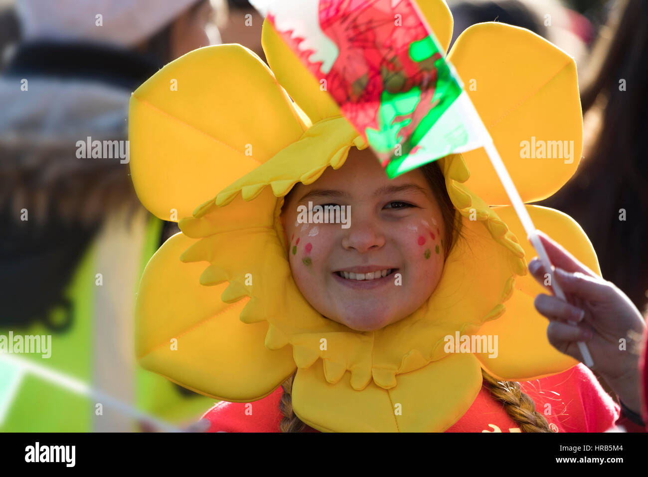 St David's Day celebrations as school children march through the town of Colwyn Bay, North Wales with welsh flags and daffodils Stock Photo