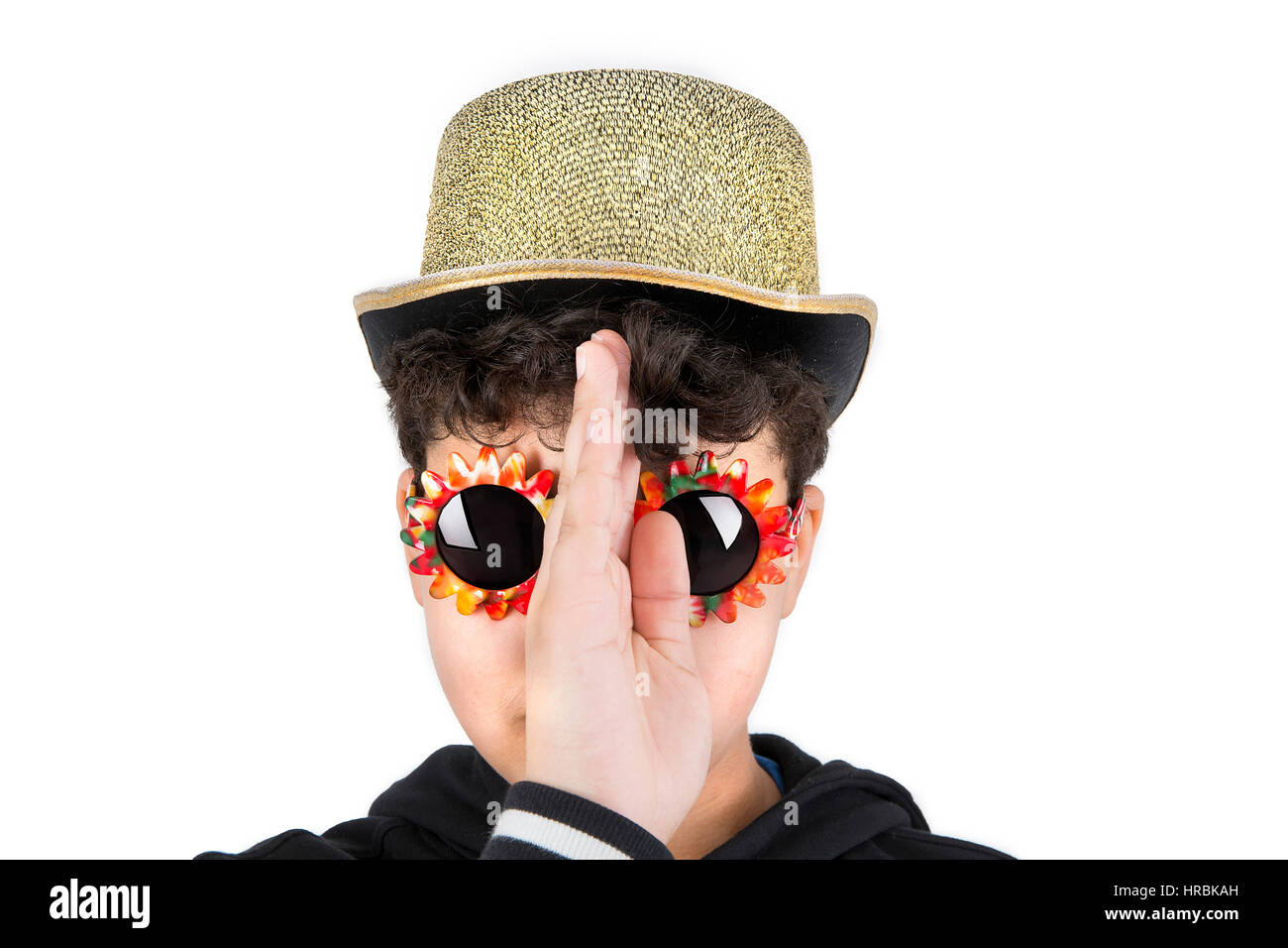 Boy wearing hat and sunglasses in studio setting. Stock Photo