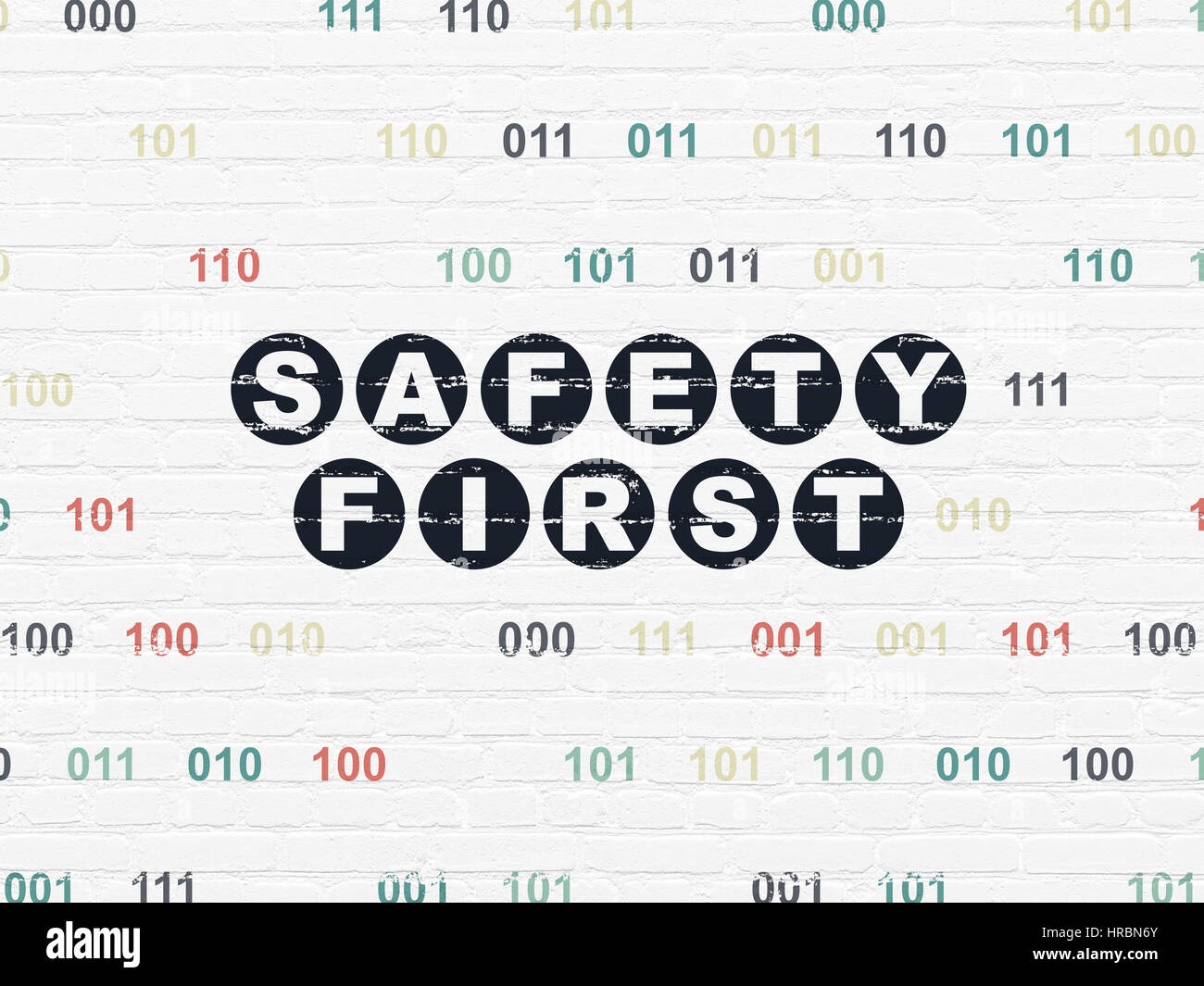 Security concept: Safety First on wall background Stock Photo - Alamy