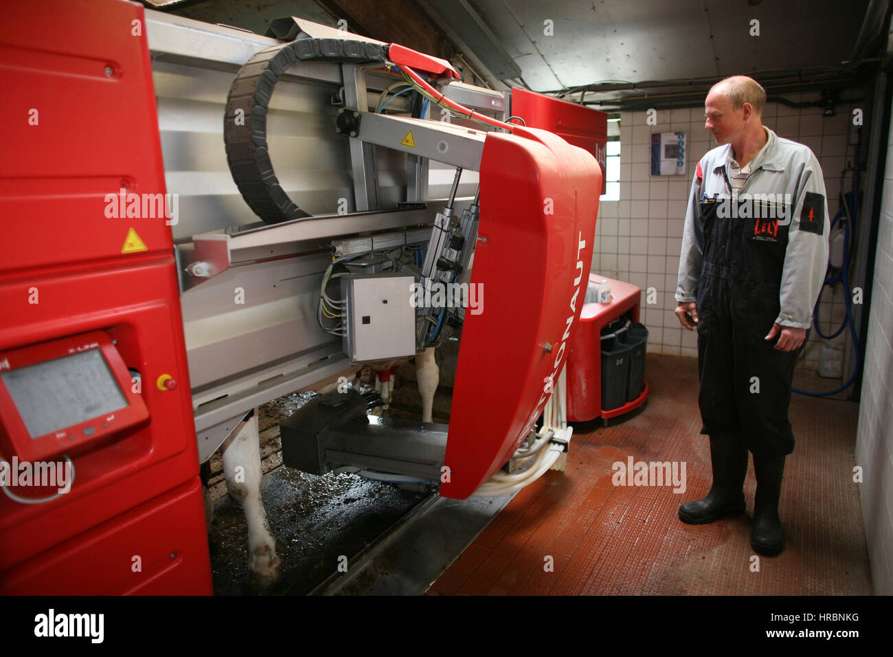Farmer milking cows machine hi-res stock photography and images - Alamy