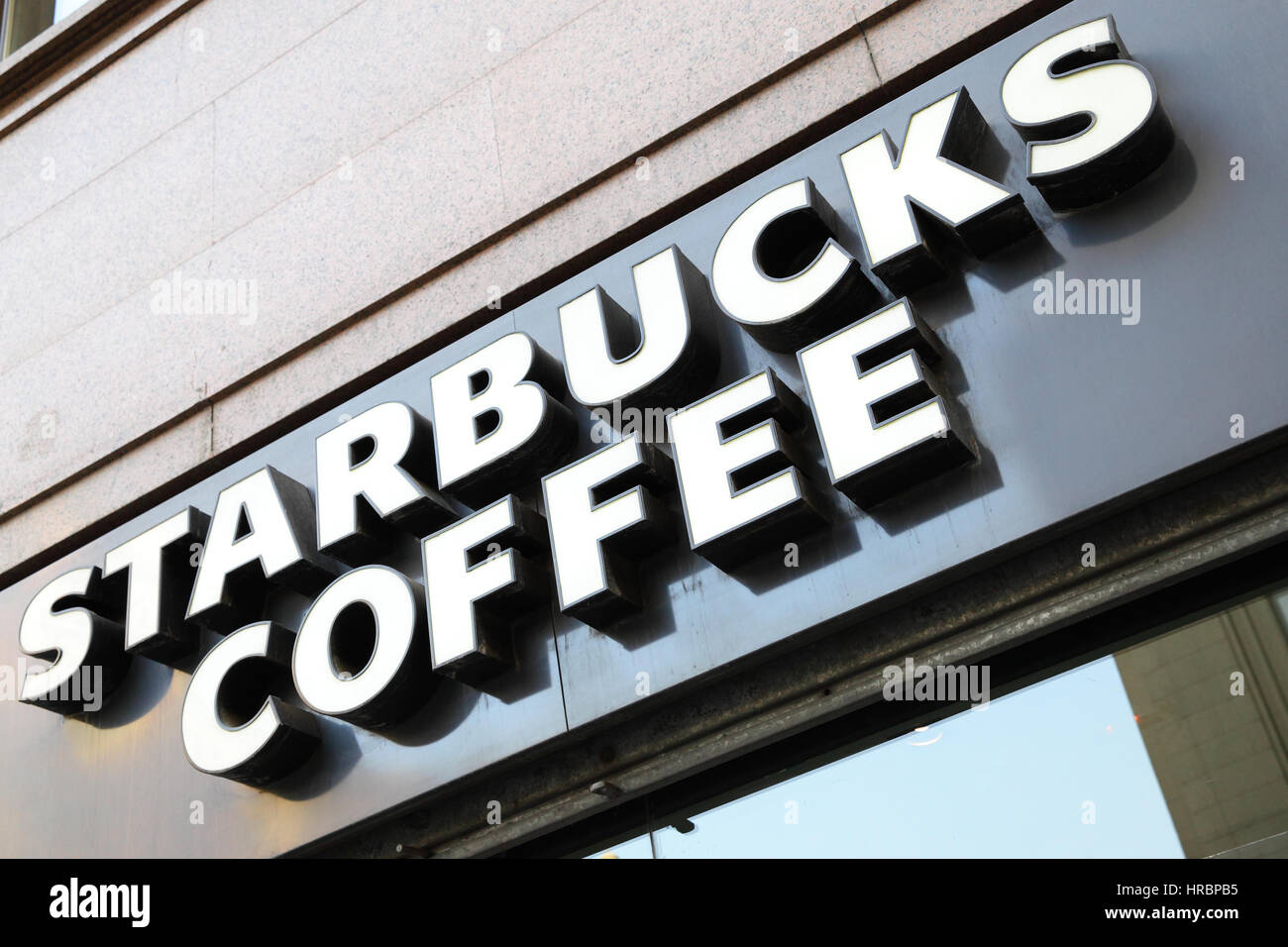 MADRID, SPAIN - September 06, 2016: Starbucks coffee shop sign close-up. Starbucks is the largest coffeehouse in the world Stock Photo