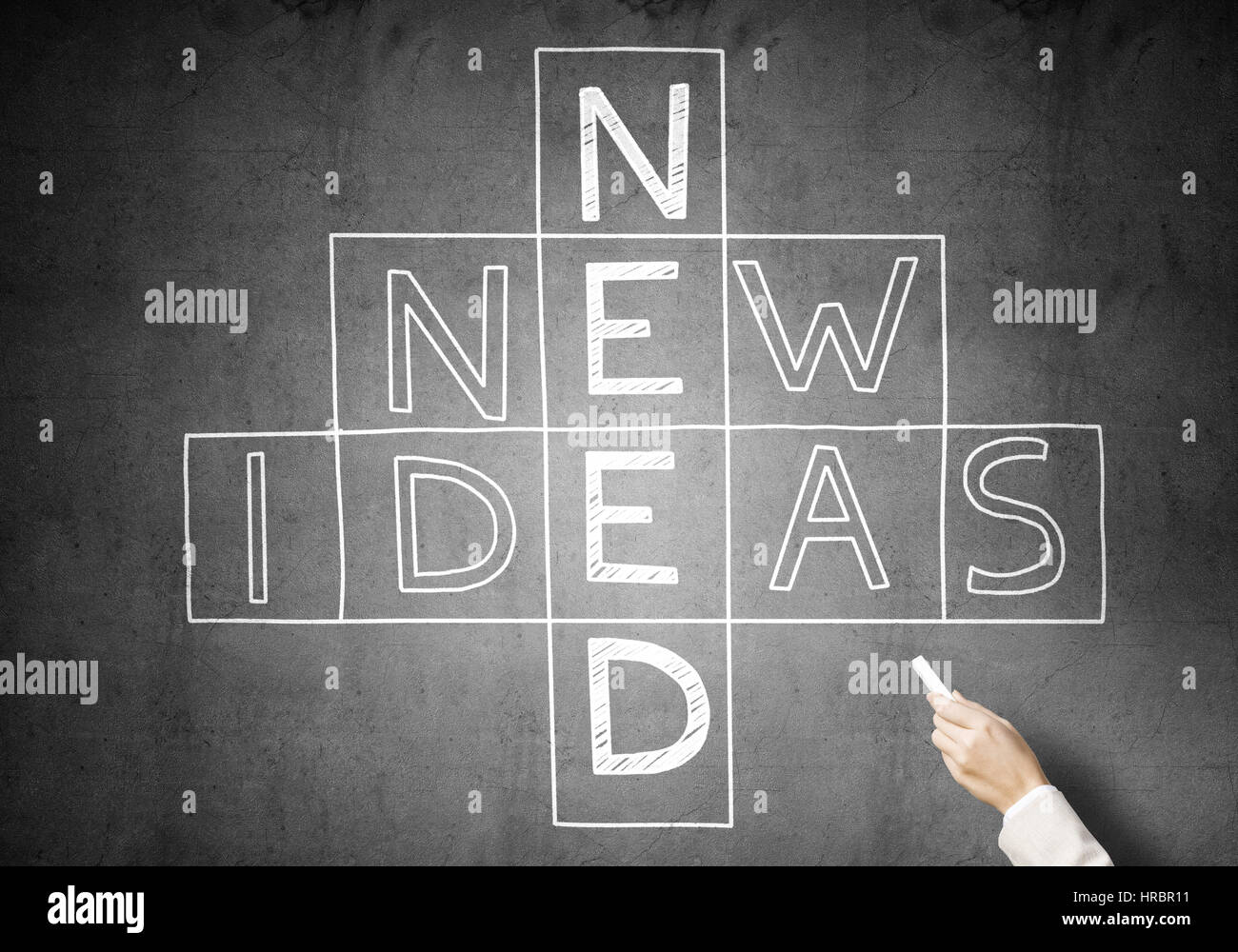 Woman draw crossword Stock Photo Alamy