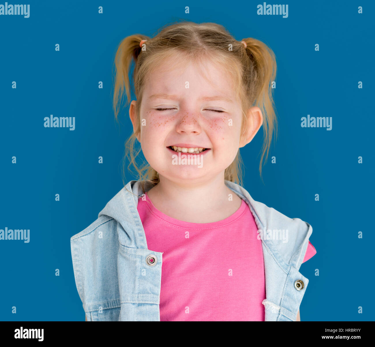 Little GIrl Smiling Happiness Playful Twintail Hairstyle Stock Photo