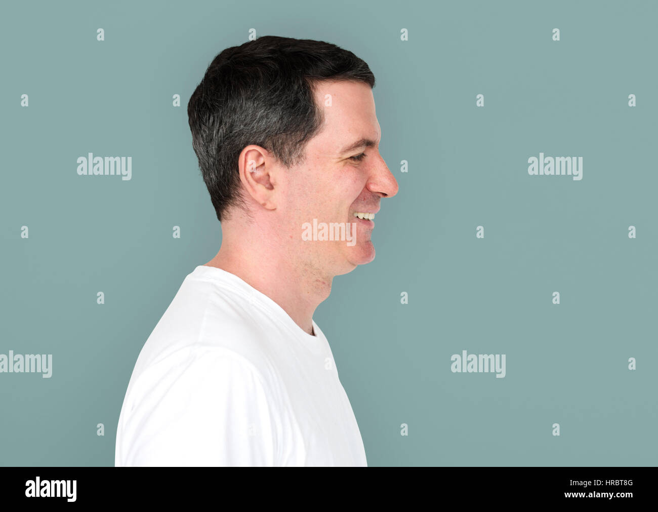 Caucasian Man Smiling Happy Side View Stock Photo - Alamy