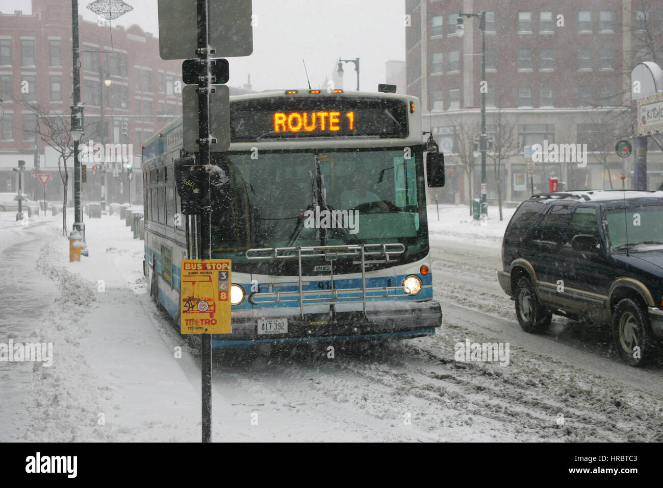 Snowstorm downtown Portland Maine bus transportation winter storm snow New England USA weather cold ice winter Stock Photo