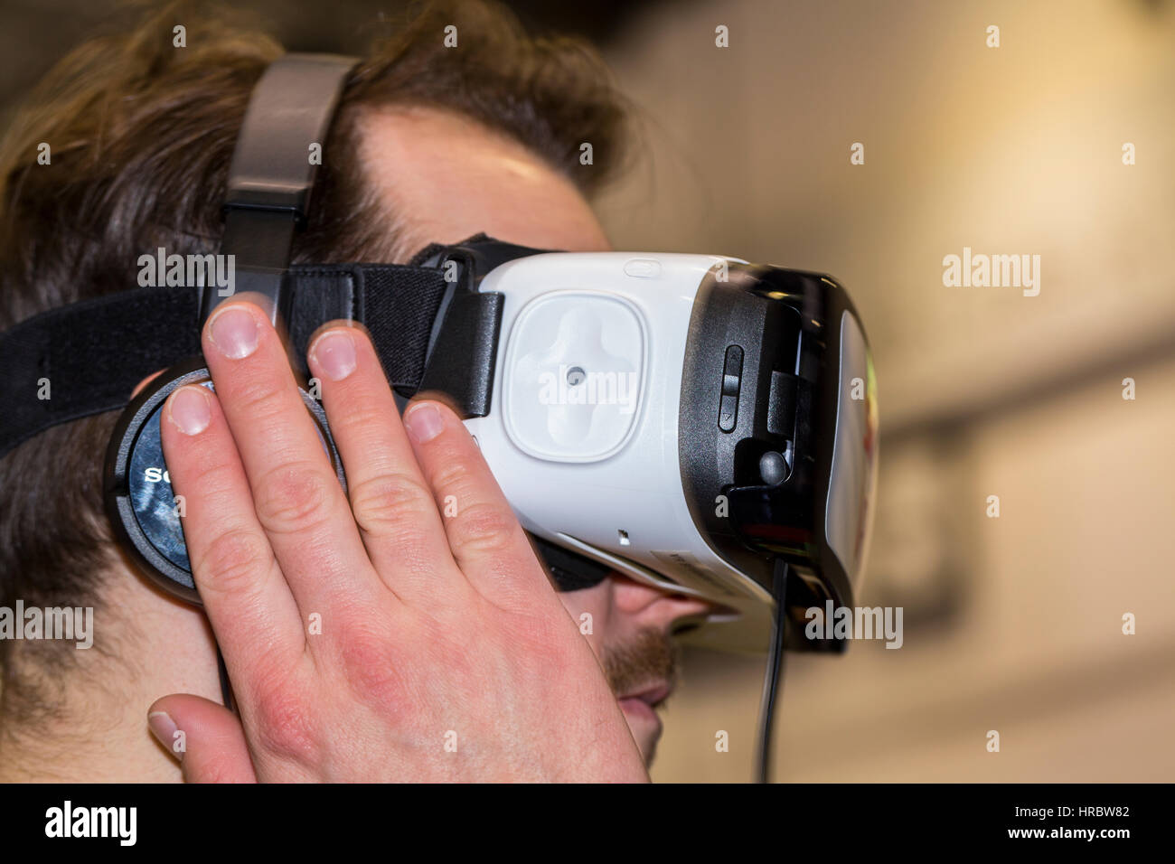 Young man wearing virtual reality glasses Stock Photo