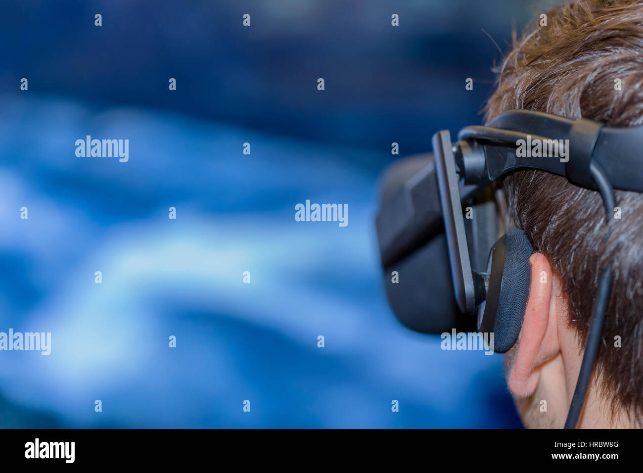 Young man wearing virtual reality glasses Stock Photo
