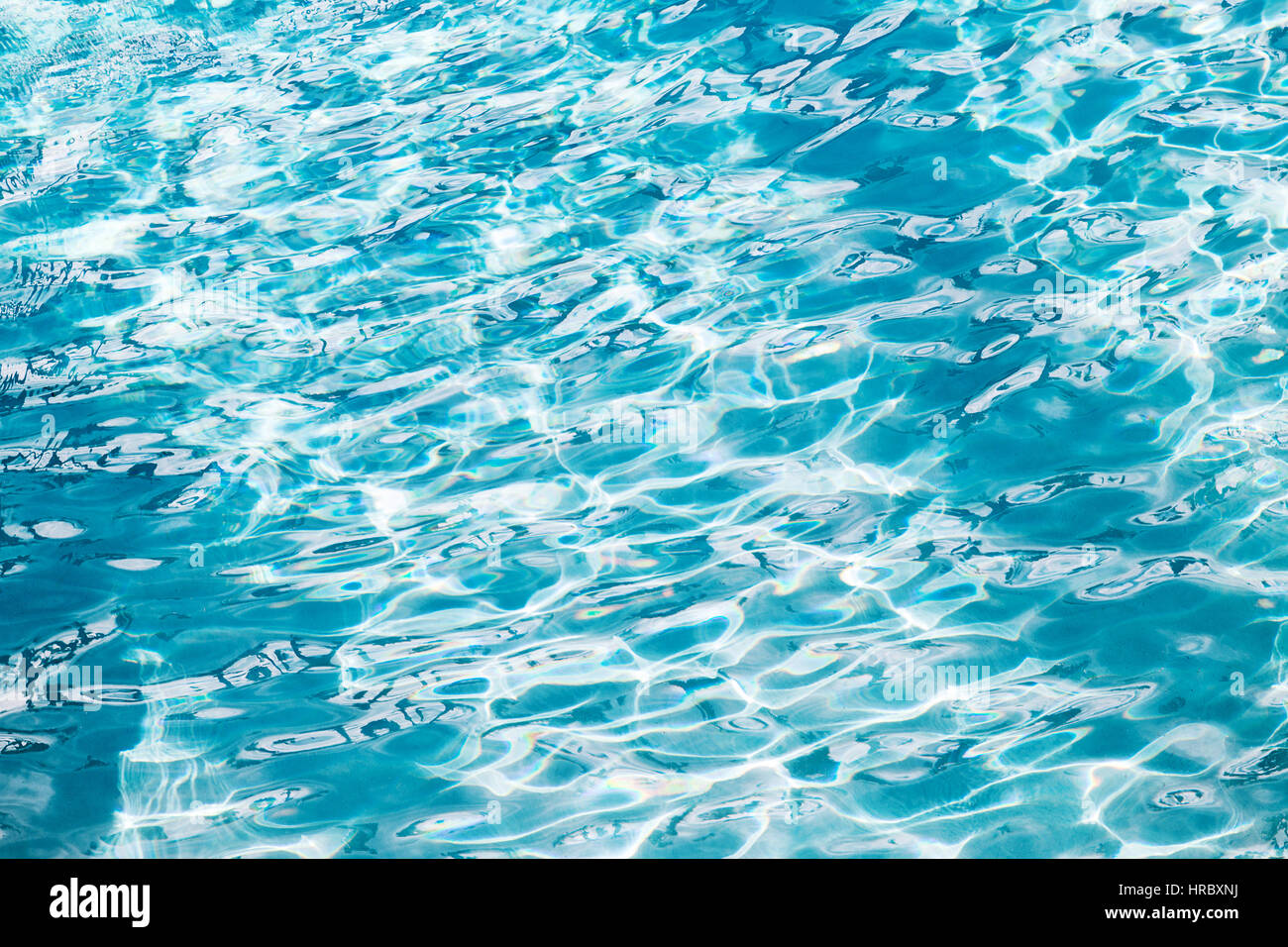 Swimming pool water and light from above Stock Photo