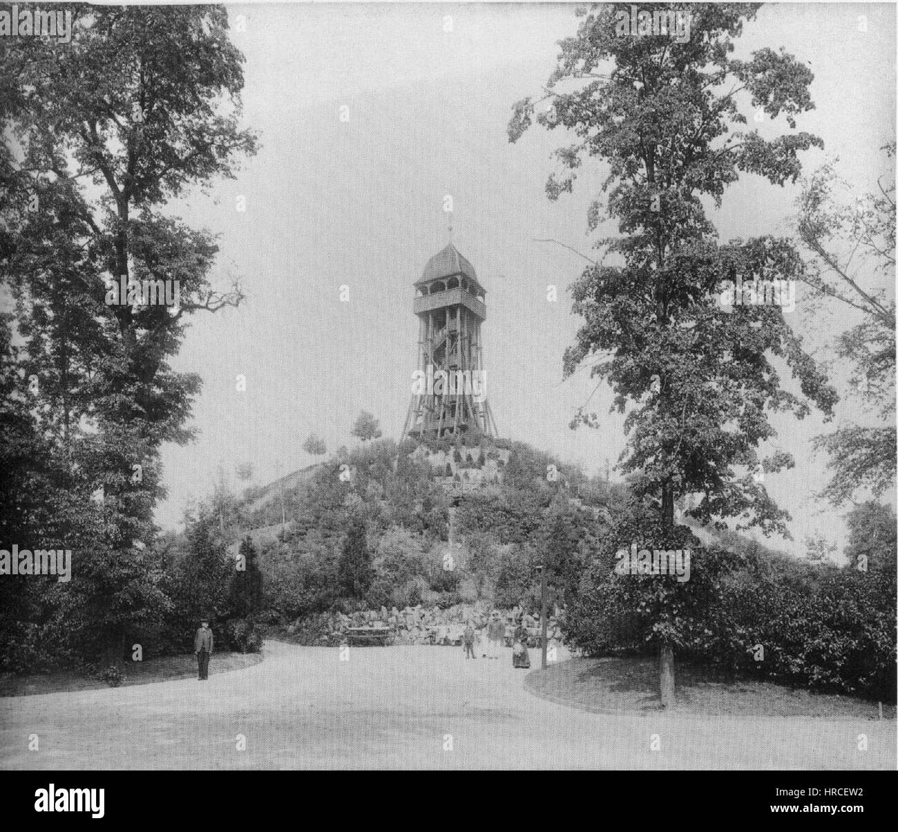 The 'Aussichtsturm um 1900' is an architectural rendering of the Rosental Tower in Leipzig. The painting highlights the structure's intricate design and its role as a prominent landmark during the early 20th century, symbolizing industrial progress and urban development. Stock Photo