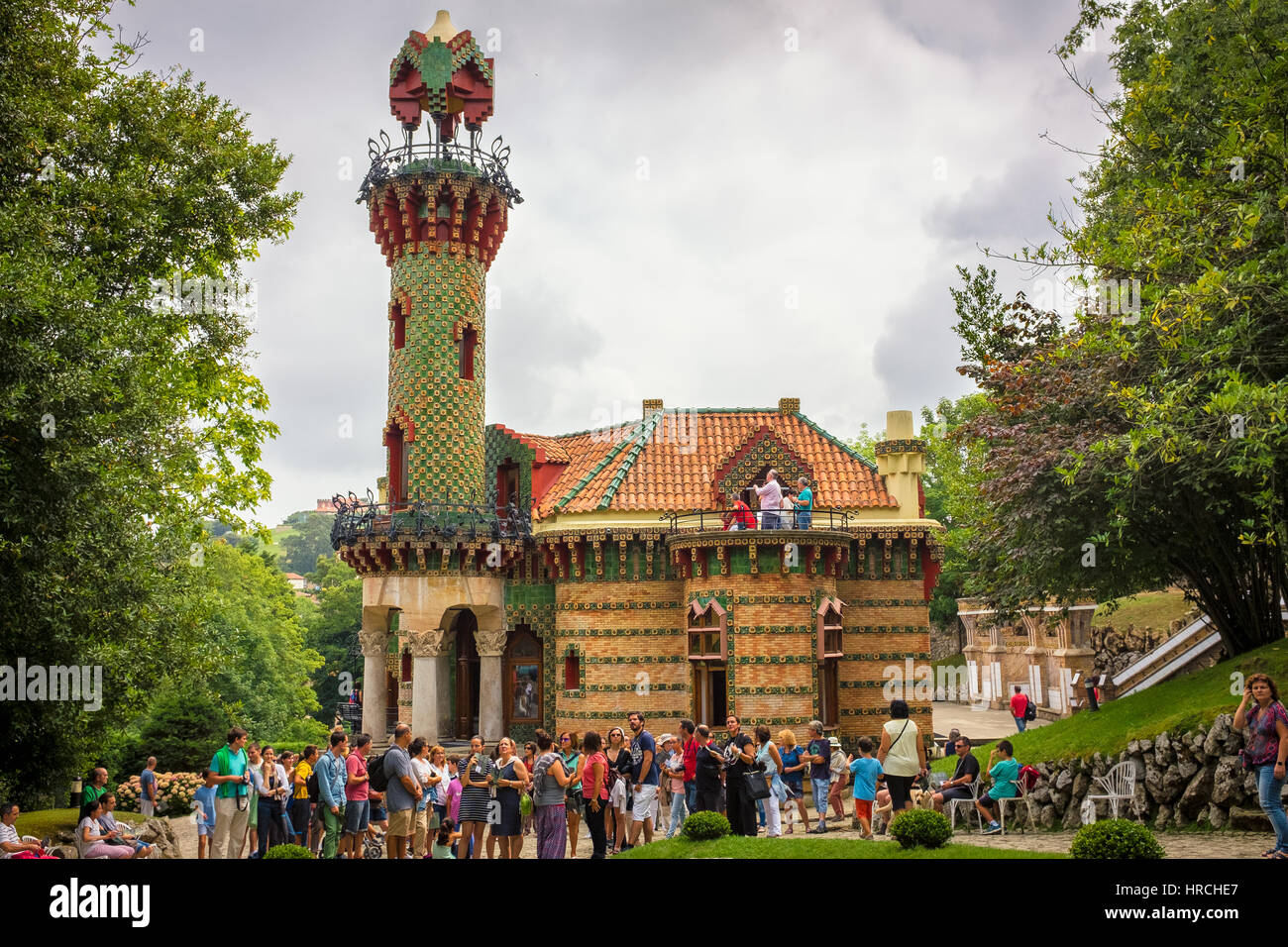 Tourists viewing the distinctive Folly or El Capricho by Antoni Gaudi in Comillas, Cantabria, Spain Stock Photo
