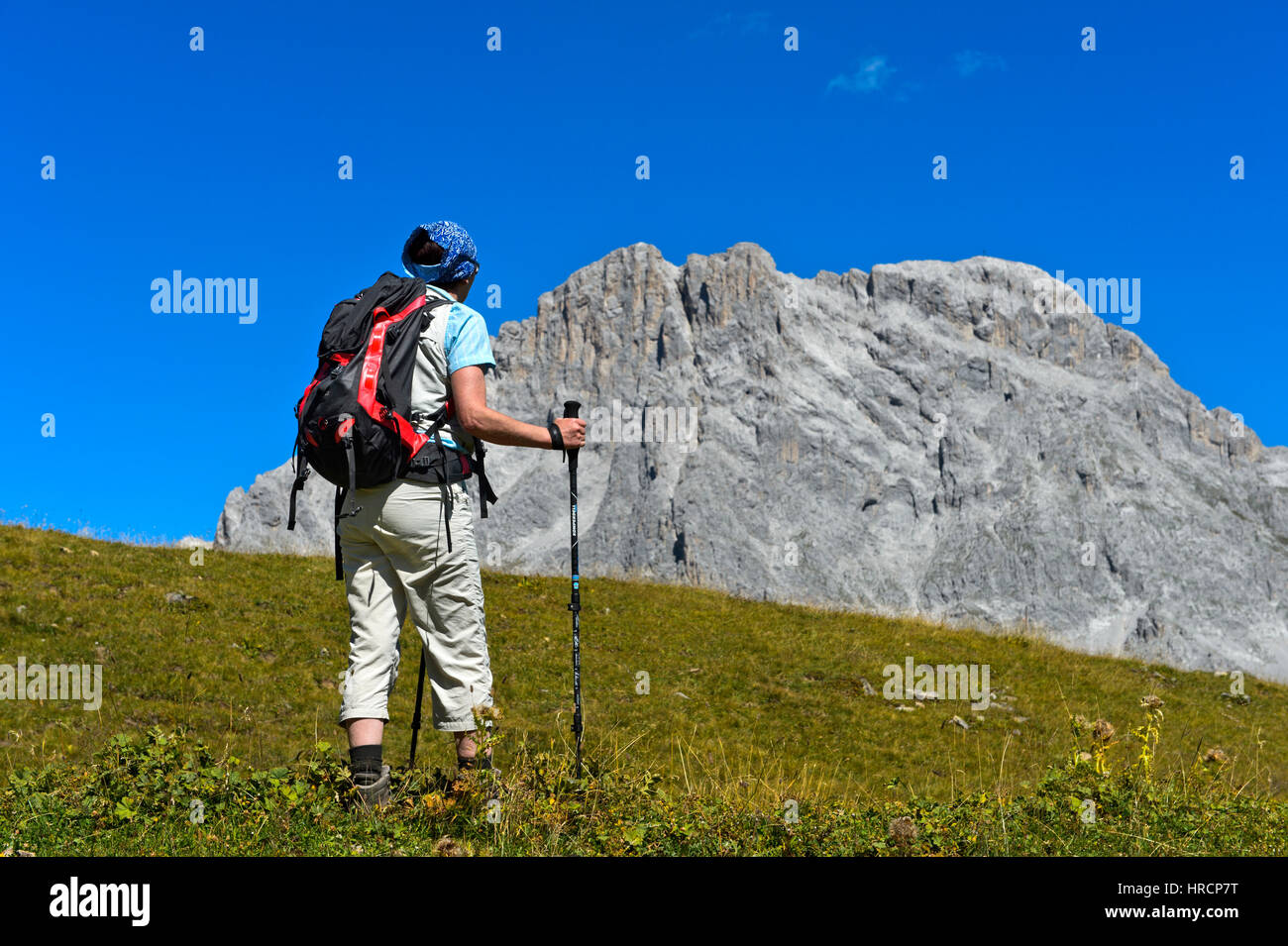 Hiker in front of the peak Sulzfluh, St. Antönien, Prättigau, Graubünden, Grisons, Switzerland Stock Photo