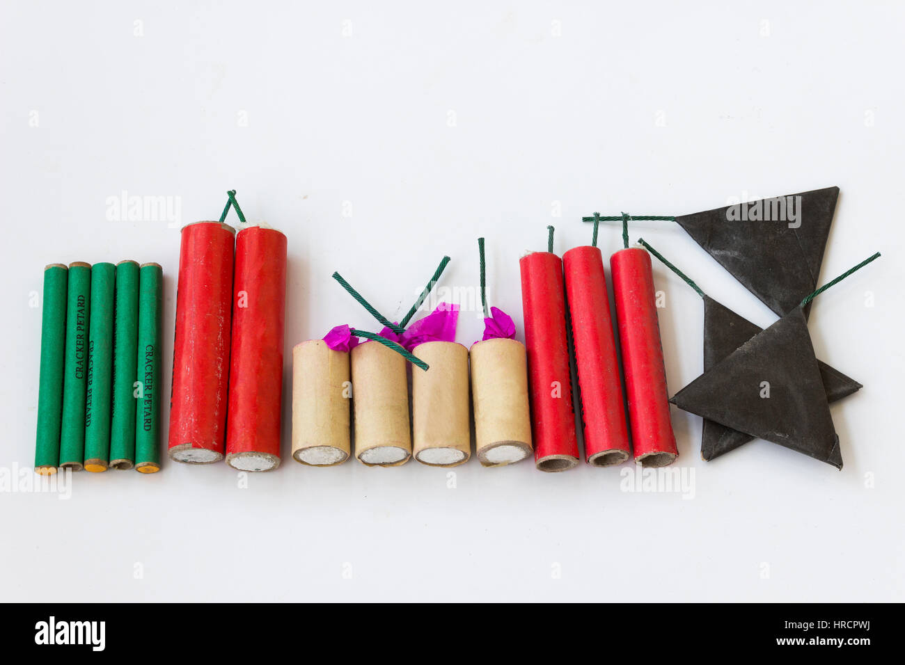 Firecrackers of different types and shapes on a white background Stock Photo