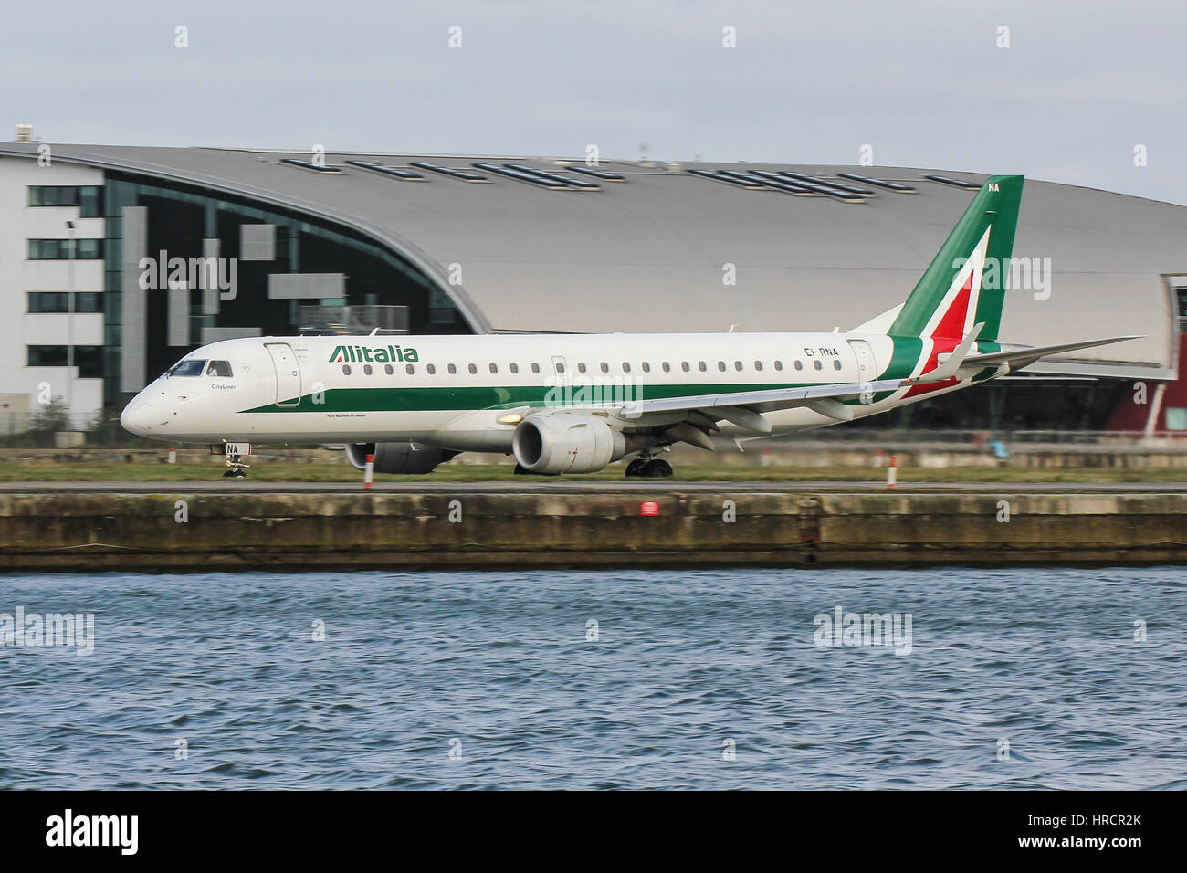 Alitalia Cityliner Embraer ERJ-190 landing at London City Airport Stock Photo