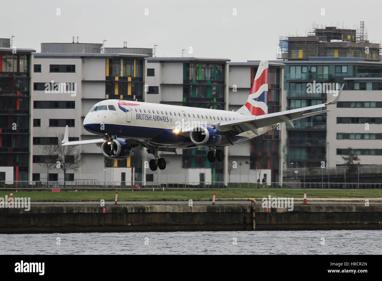 British Airways Embraer ERJ-190 landing at London City Airport Stock Photo