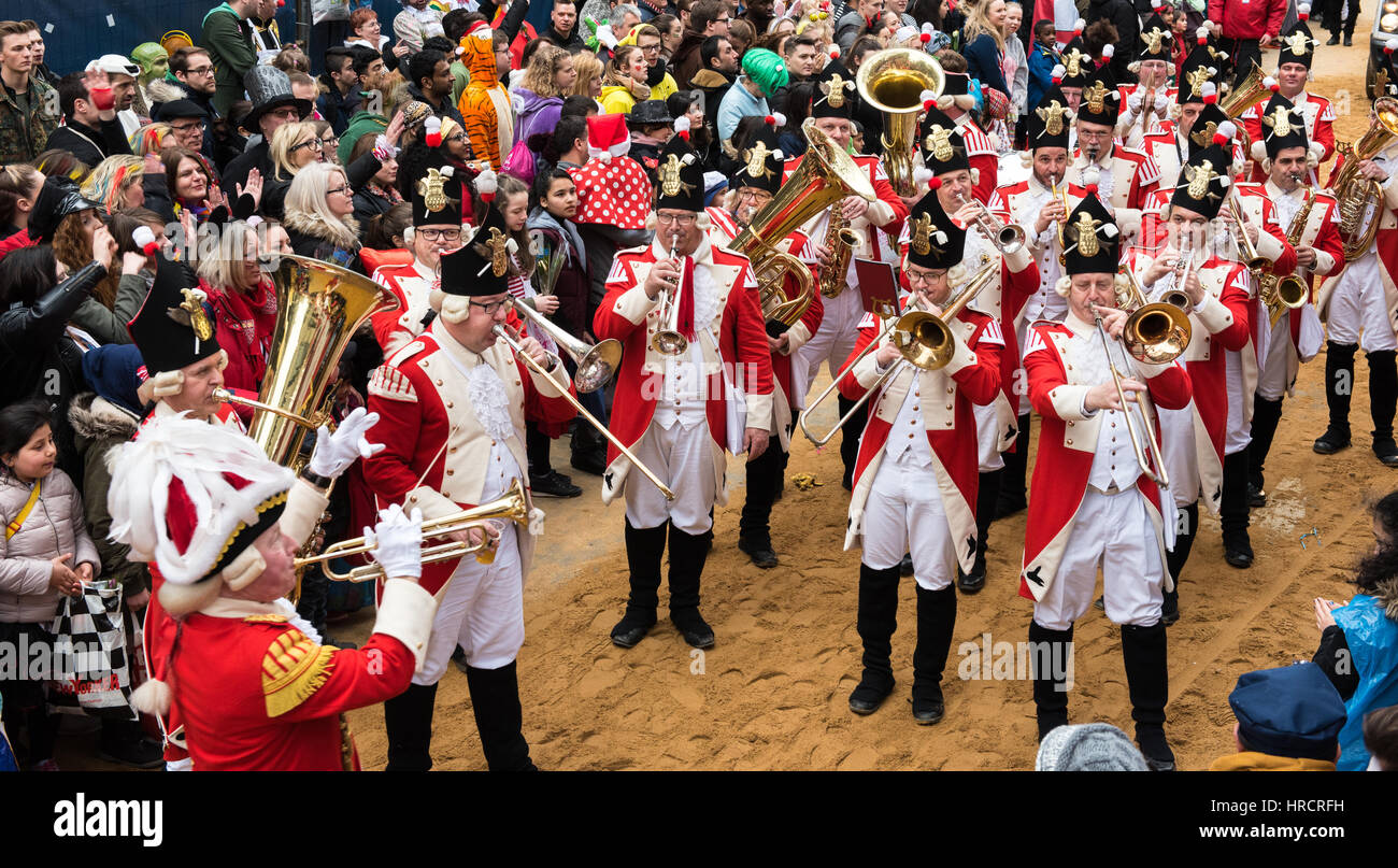 Marching band in uniform in the rose monday parade with audience Stock Photo