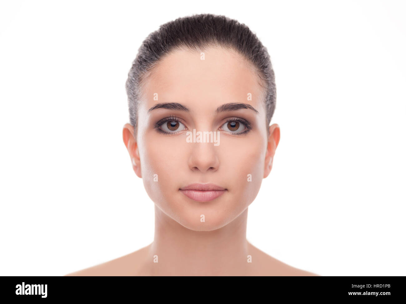 Attractive young woman with glowing face skin smiling and posing on ...