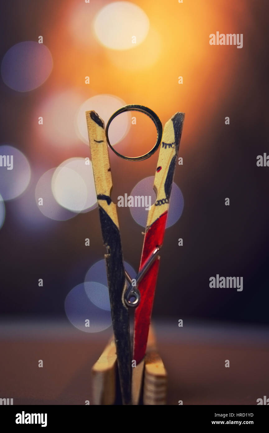 Clothespin couple and a wedding ring. Color effects and custom white
