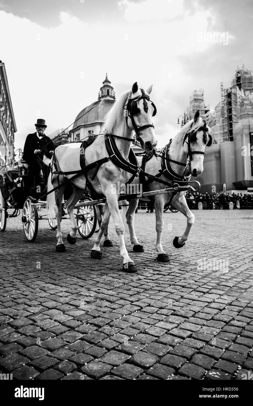 images of the Roman Carnival, held in Piazza del Popolo in Rome, with the spectacle of the largest horse show in Europe,and the Lancers of Montebello Stock Photo