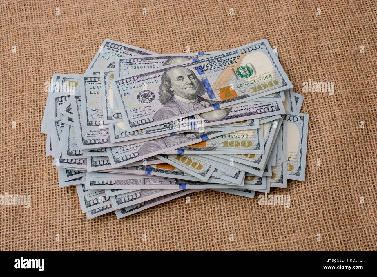 Banknote bundle of US dollar placed on a linen canvas Stock Photo - Alamy