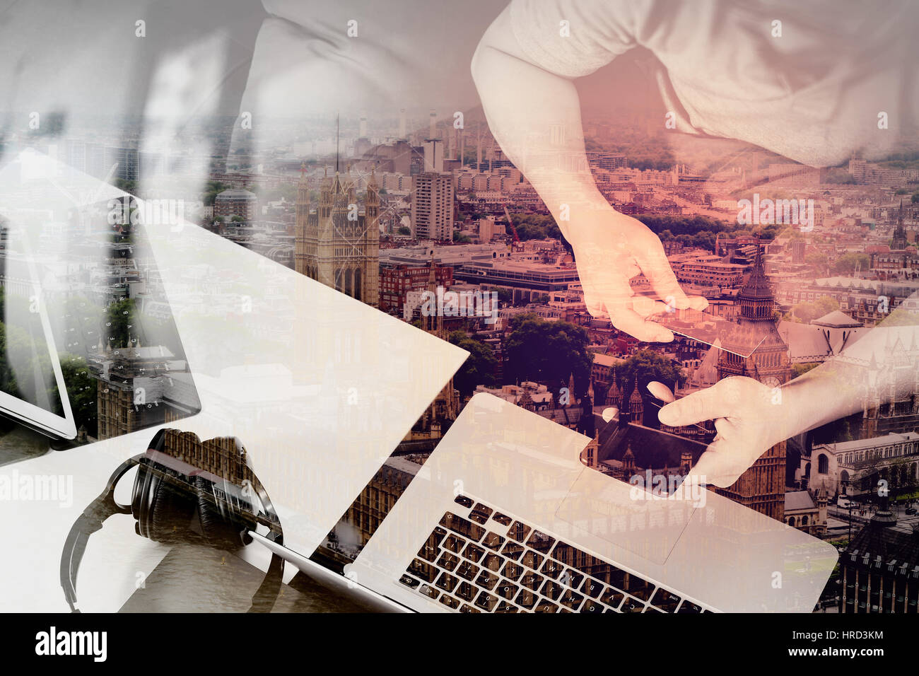 double exposure of hipster hand using smart phone and laptop compter,digital tablet docking keyboard,holding cradit card payments online business,sitt Stock Photo