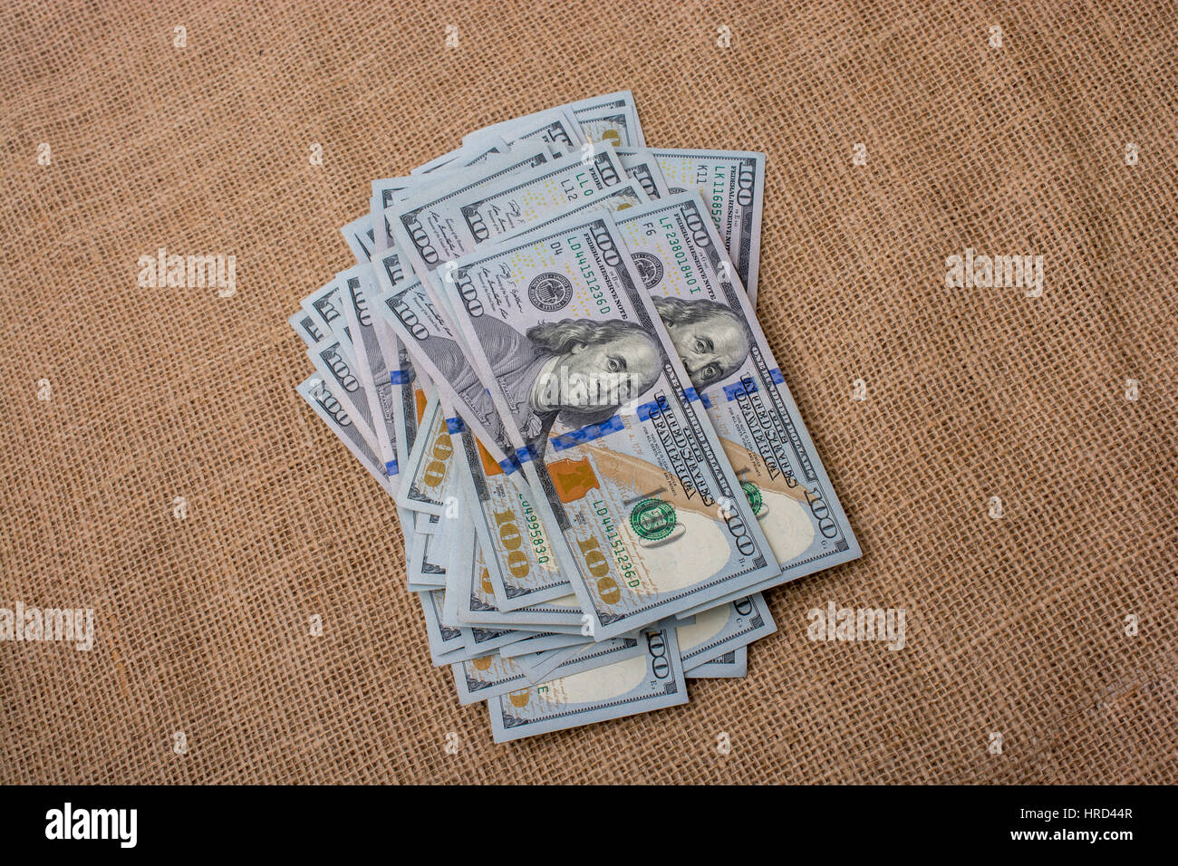 Banknote bundle of US dollar placed on a linen canvas Stock Photo - Alamy