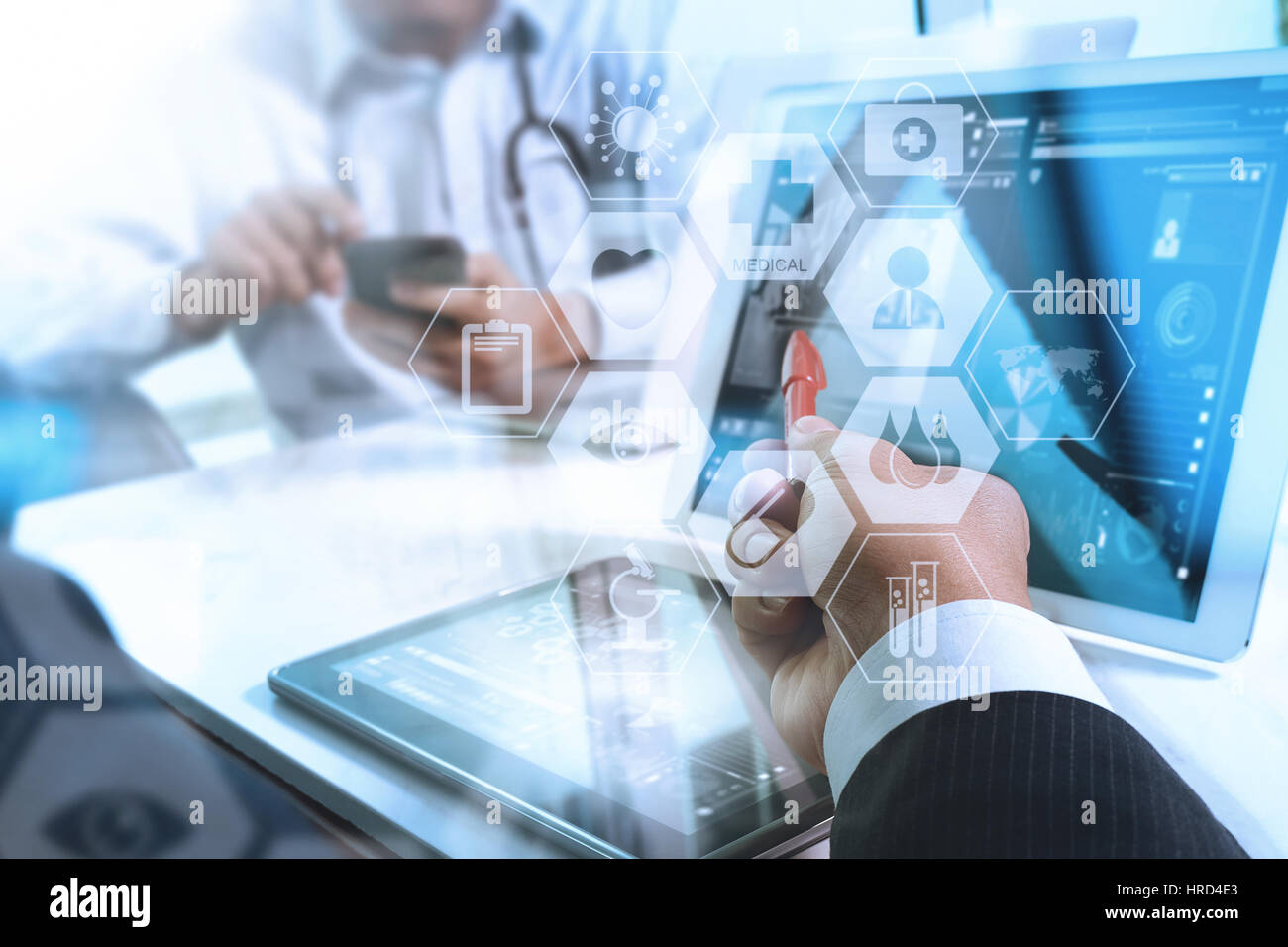 Medical Technology Network Medical technology network team concept. Doctor hand working with smart ...