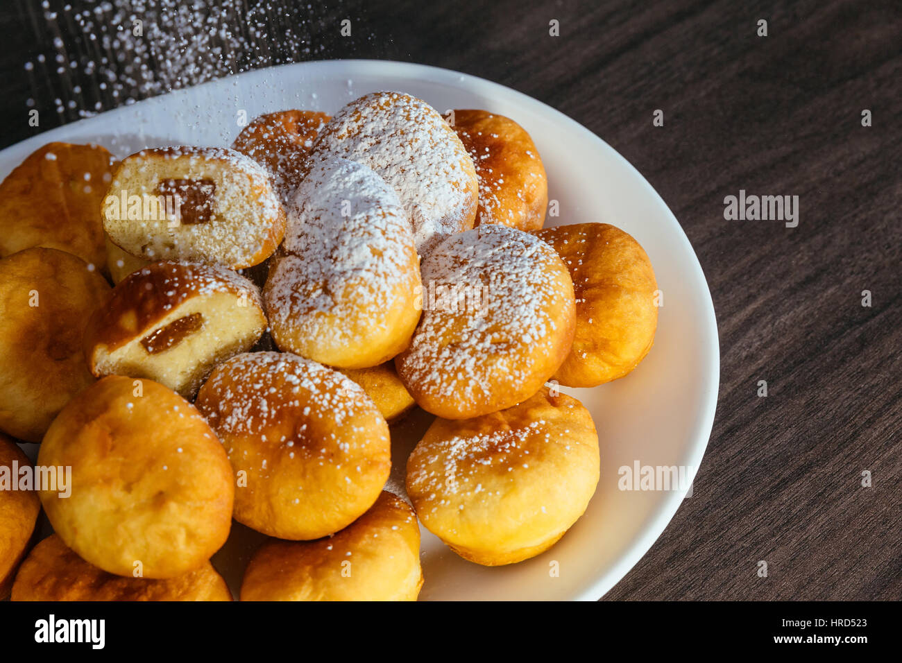 German donuts - berliner with jam and icing sugar Stock Photo