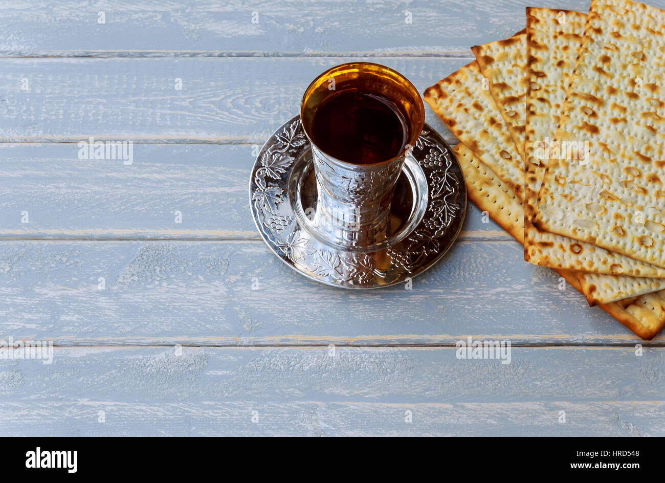 Red kosher wine with matzah or matza and a Passover Haggadah Stock Photo