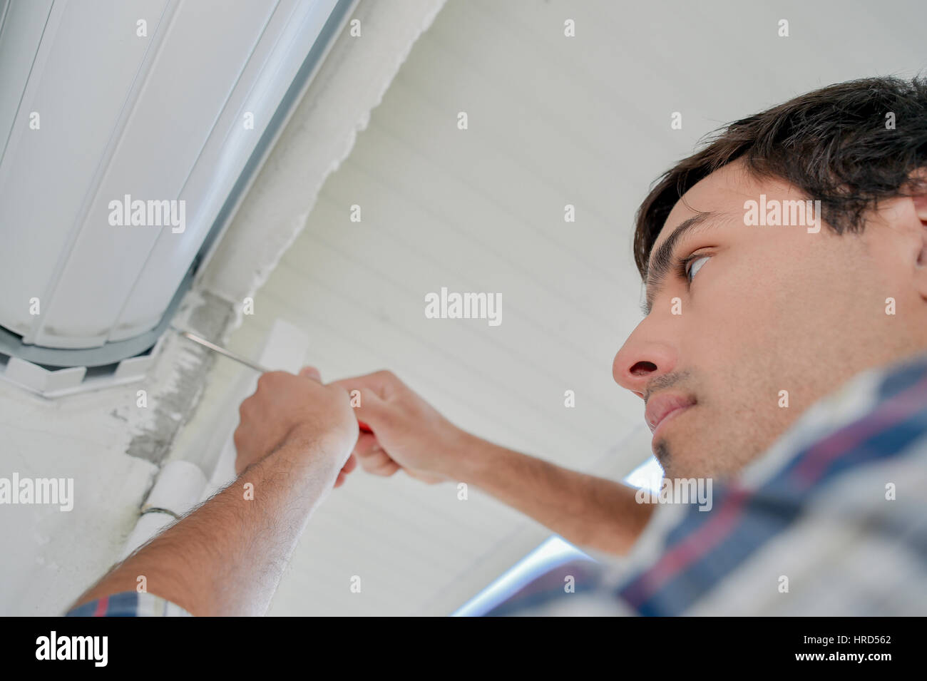 Installing window shutter Stock Photo - Alamy
