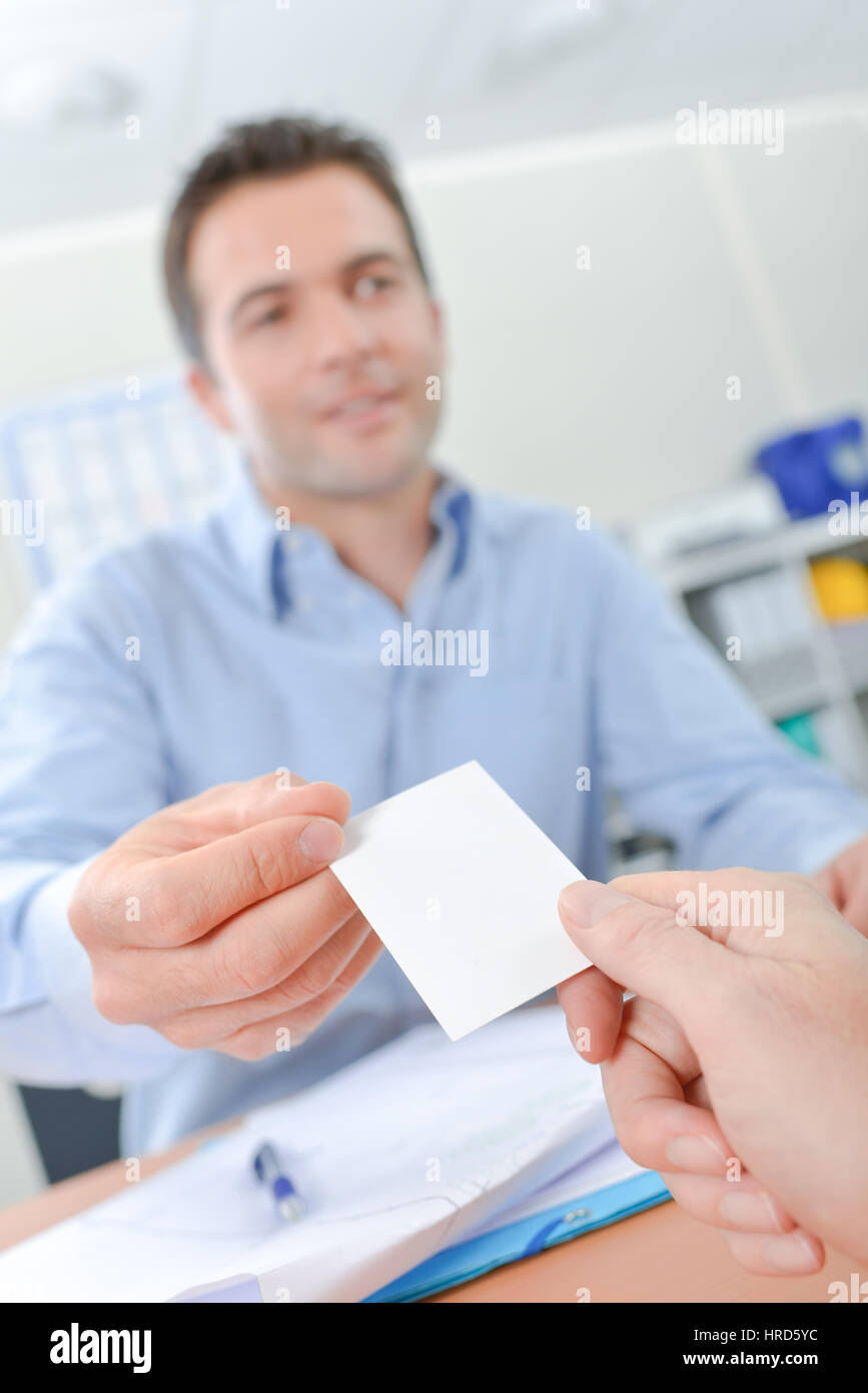 Handing out business card Stock Photo Alamy
