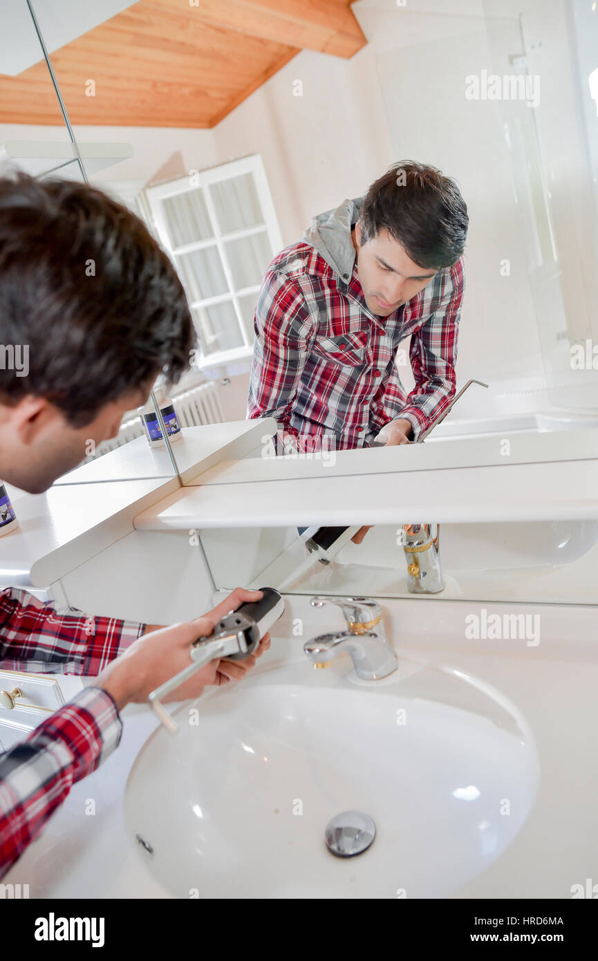 Plumber fixing a tap Stock Photo Alamy