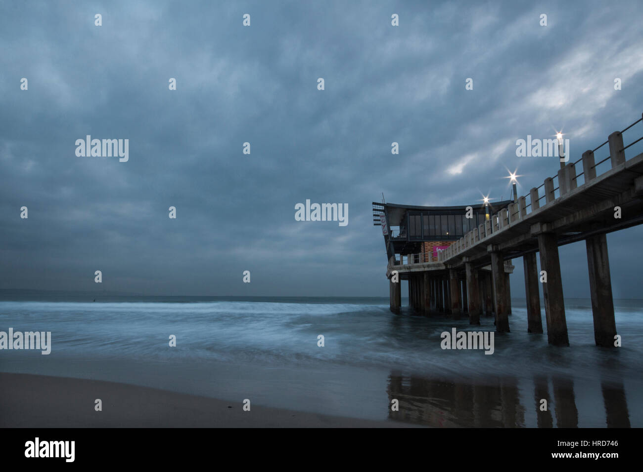 The Pier at Addington Beach on a Cloudy Morning Stock Photo