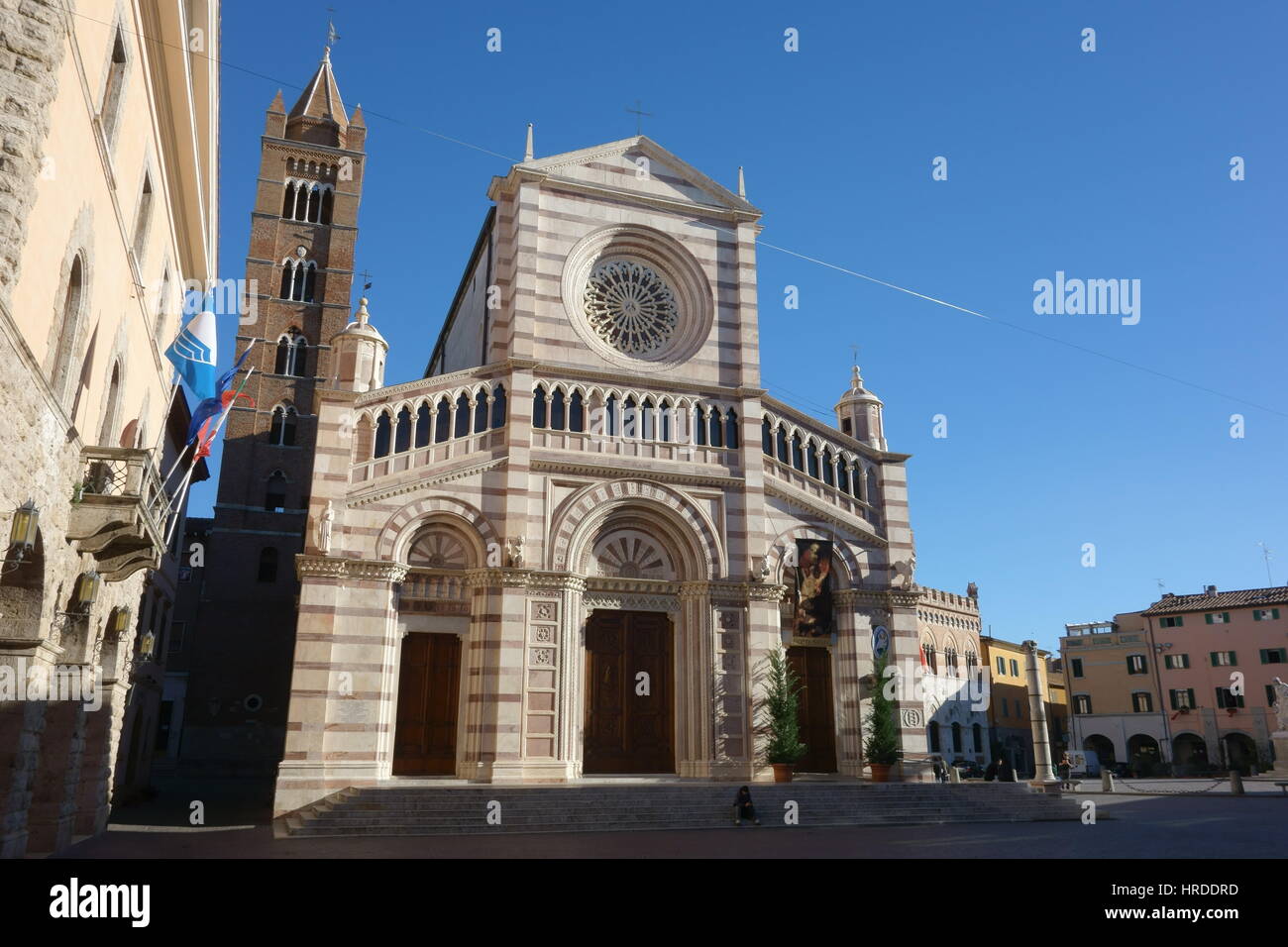 Grosseto Duomo (Cathedral) facade against a clear blue sky - Piazza Dante Alighieri / Piazza Duomo, Grosseto, Tuscany, Italy, Europe - Wide angle view Stock Photo