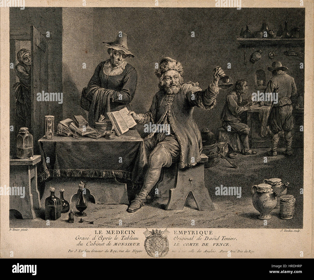 A physician in his surgery and examining a urine fl