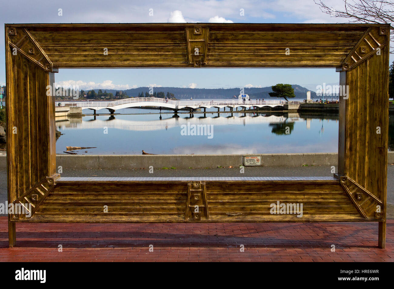 View through a huge picture frame at Maffeo Sutton Park, Nanaimo, Vancouver Island, BC, Canada to the Swy-a-Lana Lagoon Stock Photo