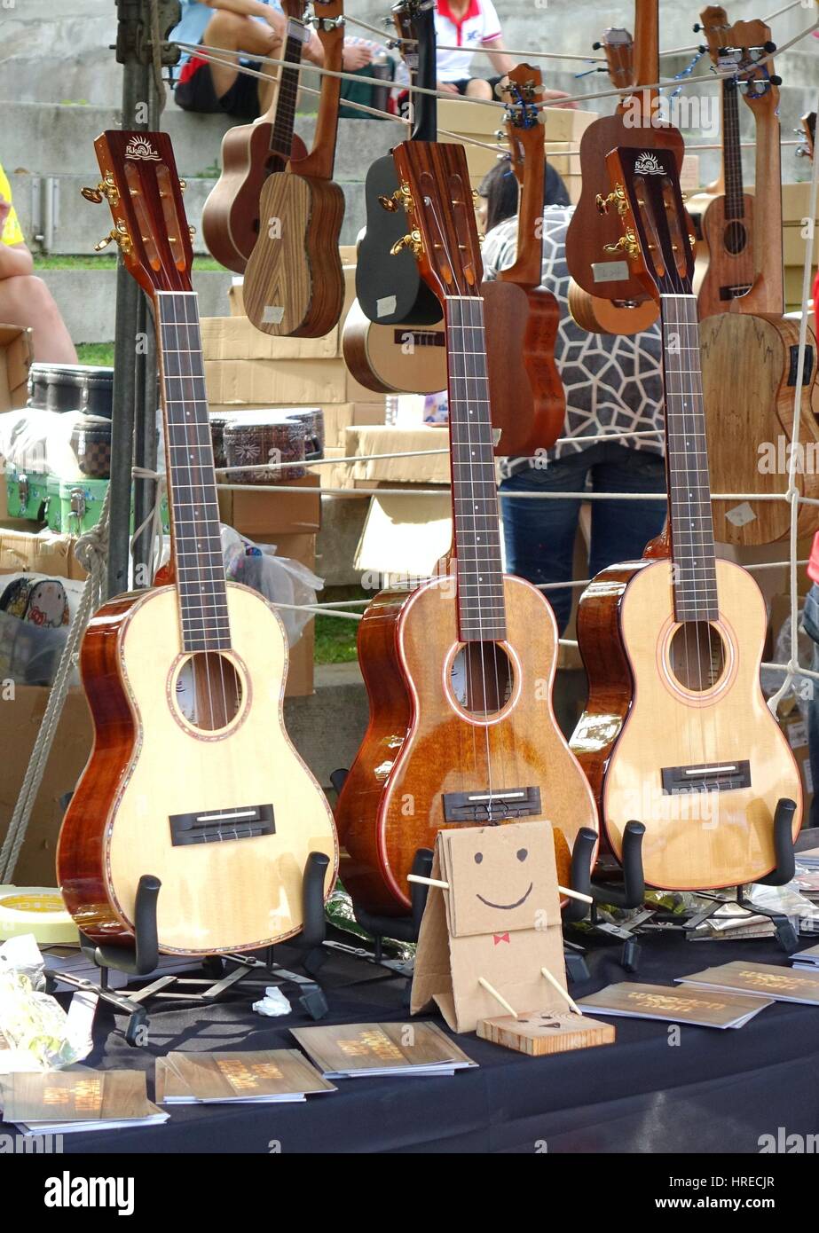 KAOHSIUNG, TAIWAN -- APRIL 23, 2016: Outdoor vendors sell musical string instruments at the 1st Pacific Rim Ukulele Festival, a free outdoor event. Stock Photo
