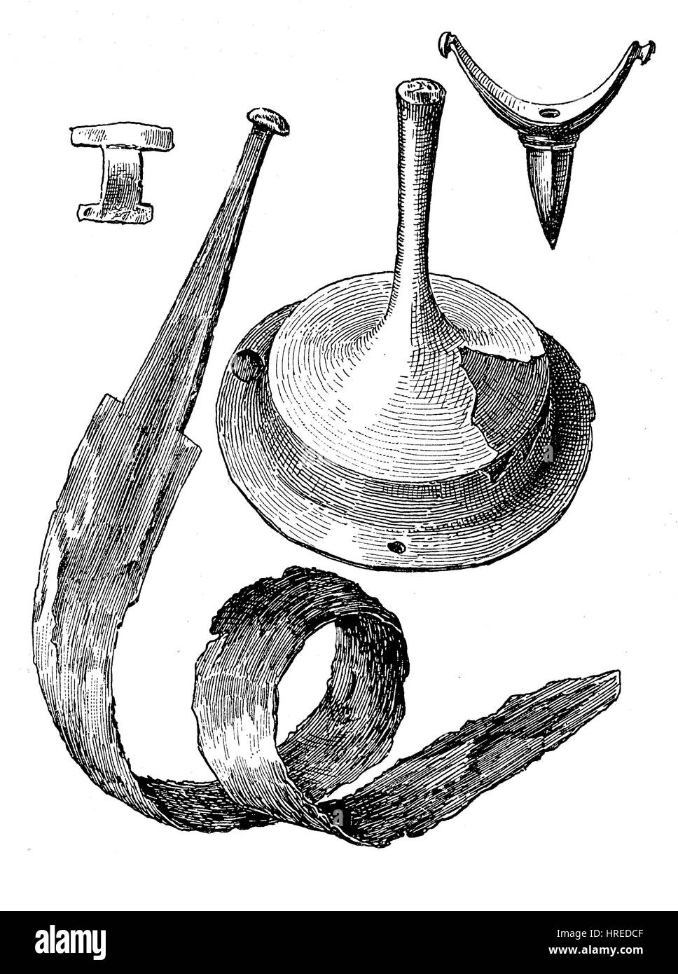 Items from the Roman period, from the left, a bronze fibula, an iron sword was bent to put it into the grave, an iron shield boss and a spur of bronze with a dull tip, Germany, reproduction of an woodcut from the 19th century, 1885 Stock Photo