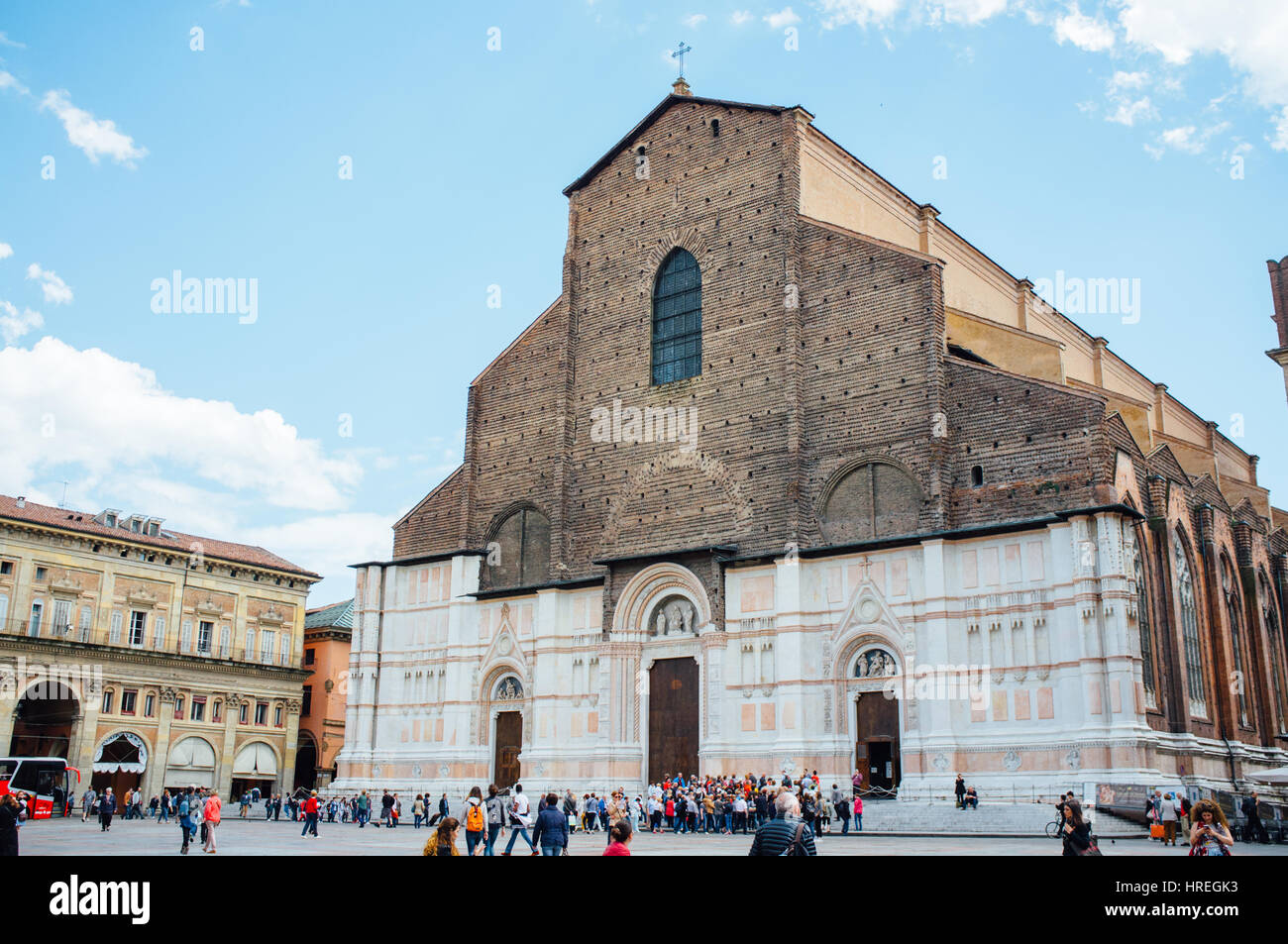 Tourists visiting the Basilica di San Petronio which is located at the Piazza Maggiore in Bologna, Italy. Stock Photo